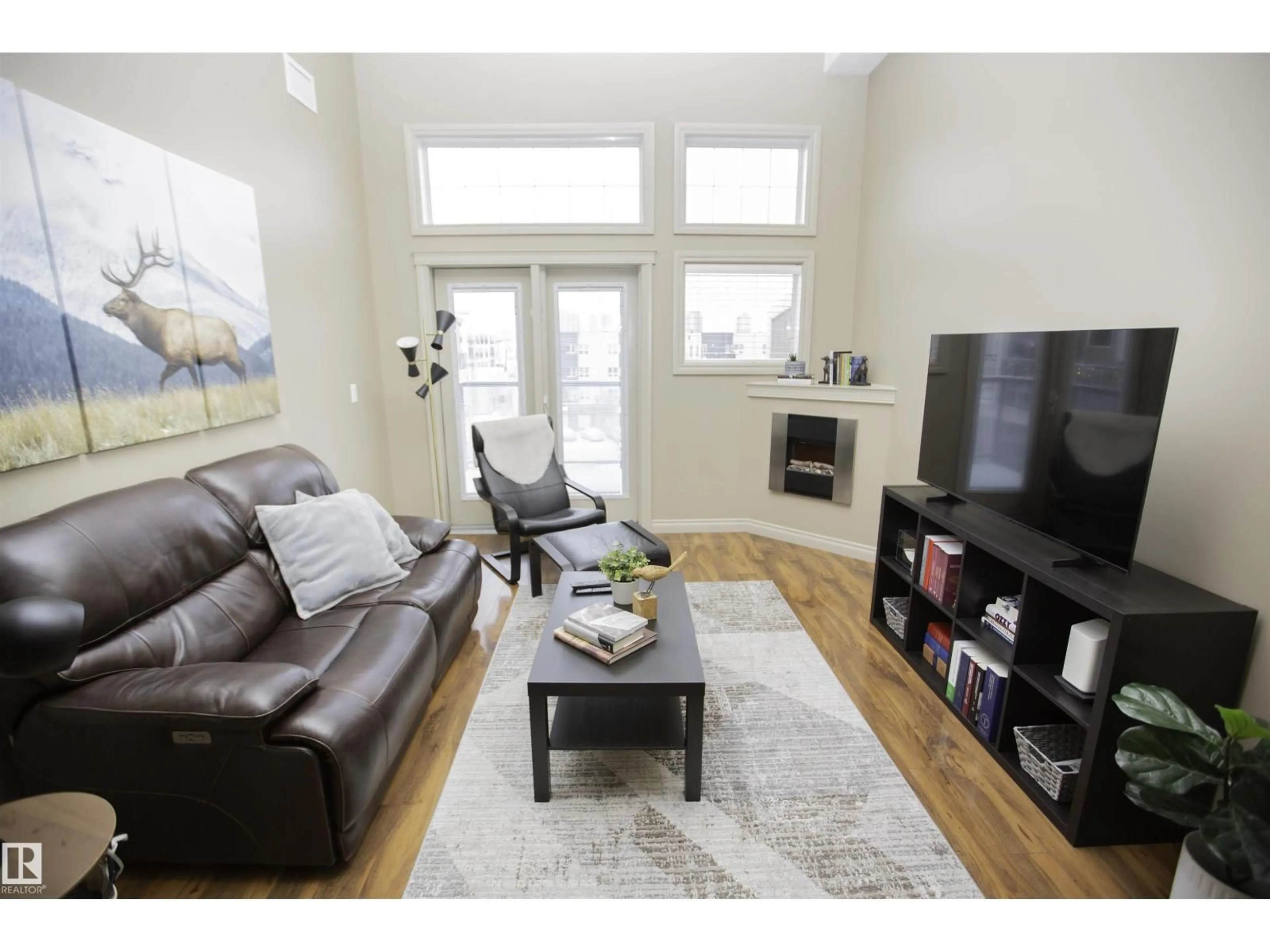 Living room with furniture, wood/laminate floor for 432 10121 80 AV AV, Edmonton Alberta T6E0B9
