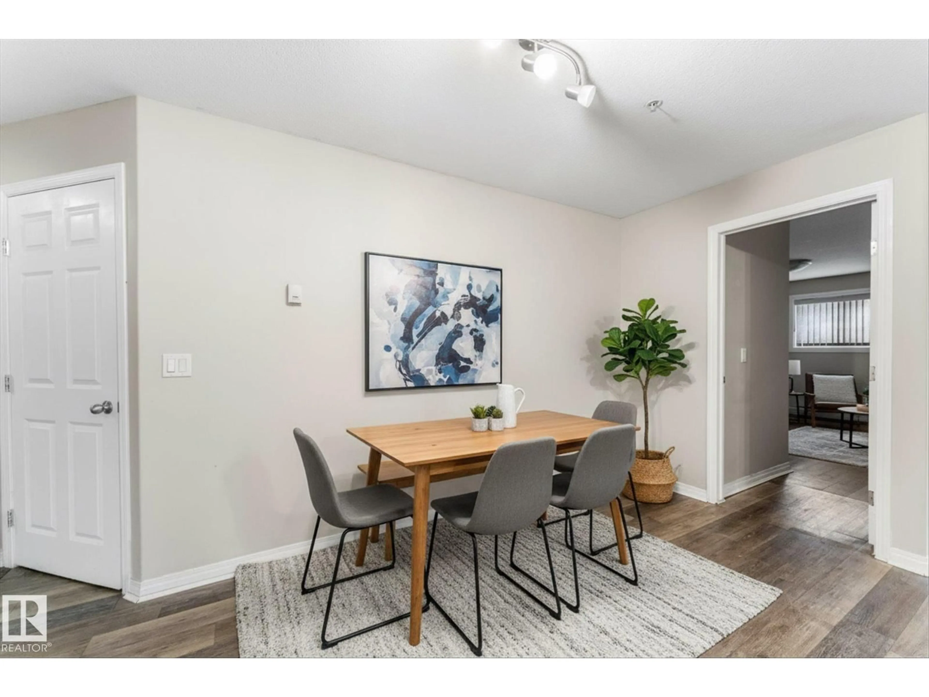 Dining room, wood/laminate floor for #112 - 9945 167 ST, Edmonton Alberta T5P0K5
