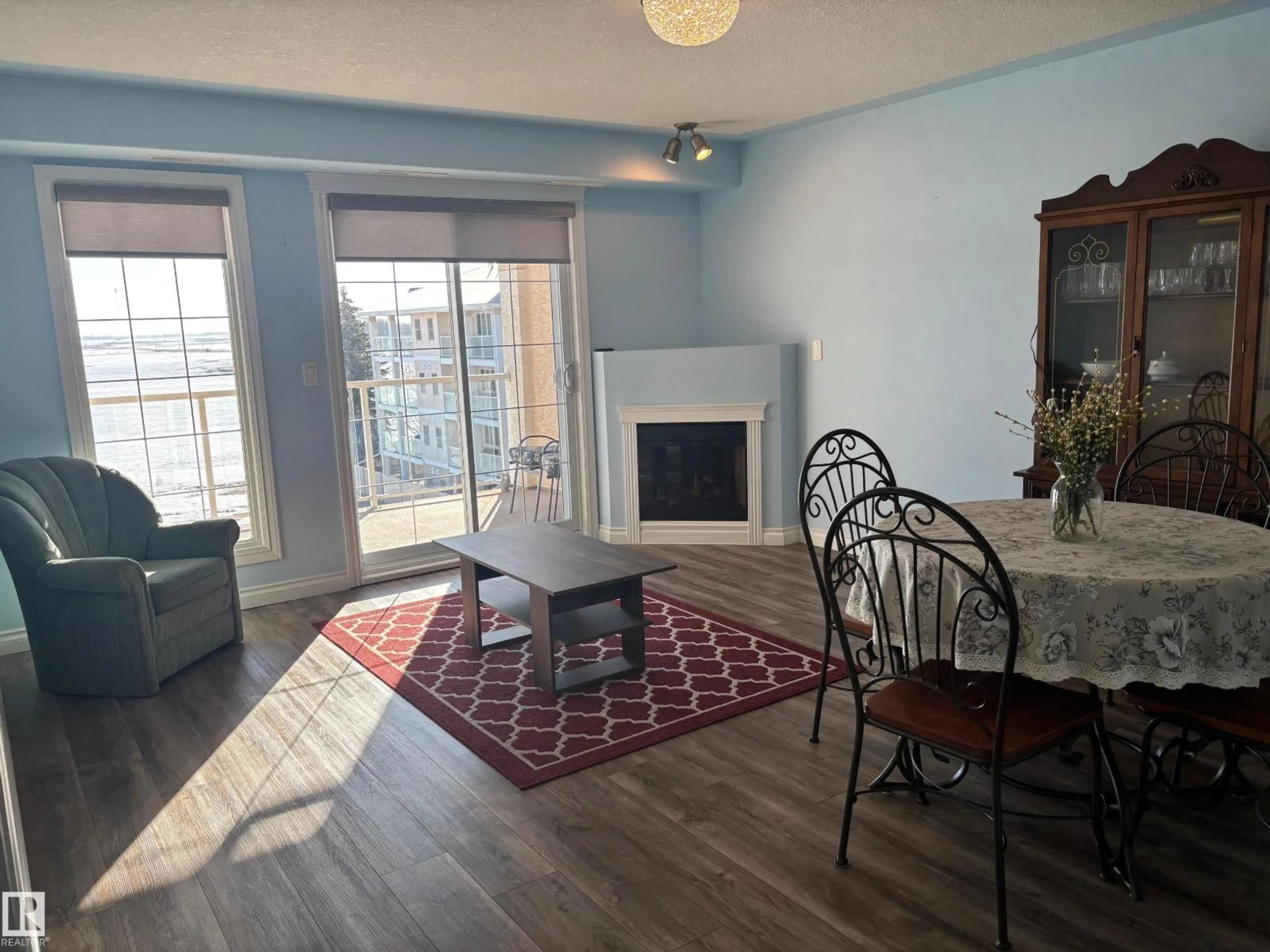 Living room with furniture, wood/laminate floor for 423 7801 GOLF COURSE RD, Stony Plain Alberta T7Z0C7