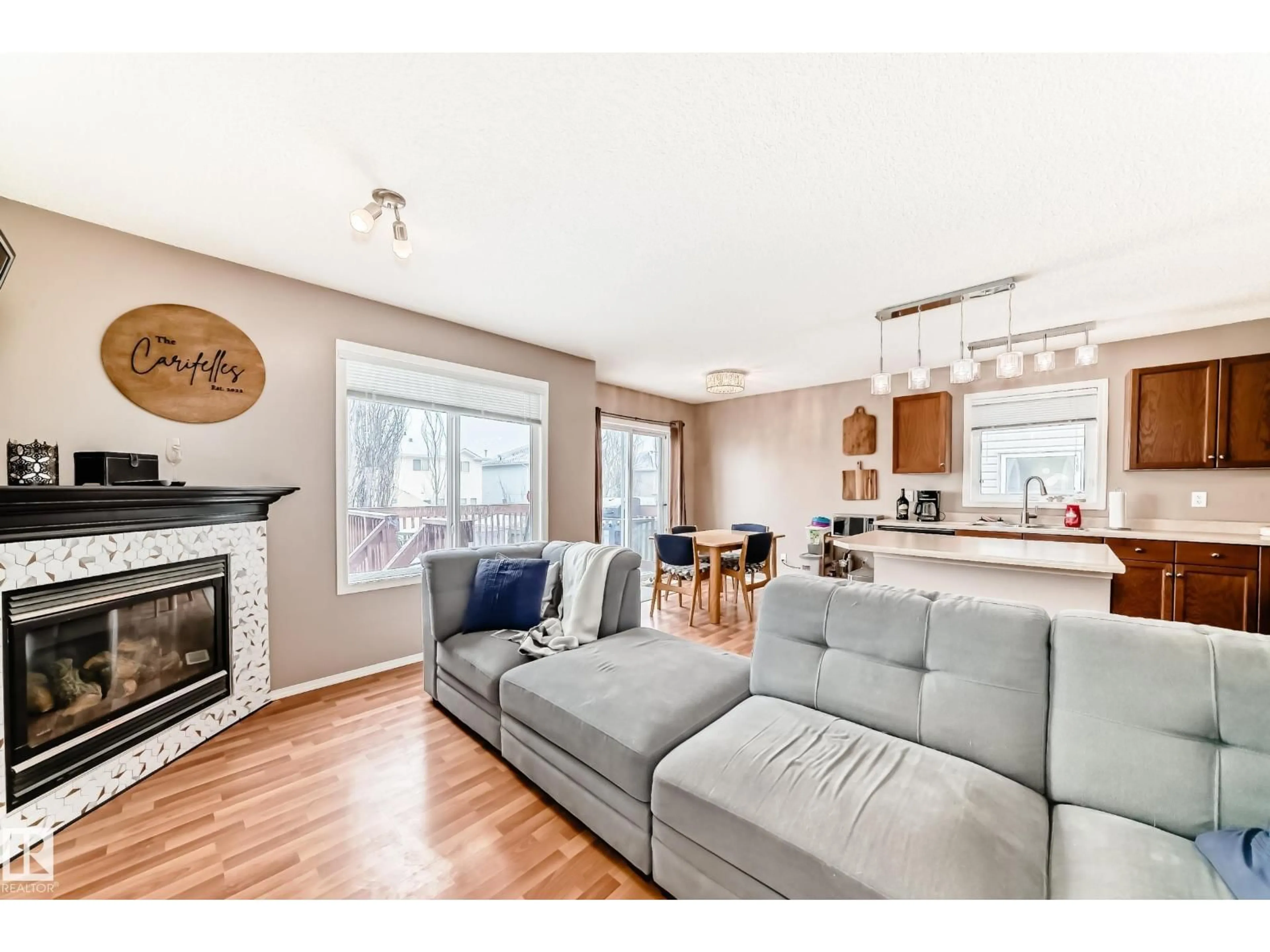 Living room with furniture, wood/laminate floor for 42 - 115 CHESTERMERE DR, Sherwood Park Alberta T8H2W4