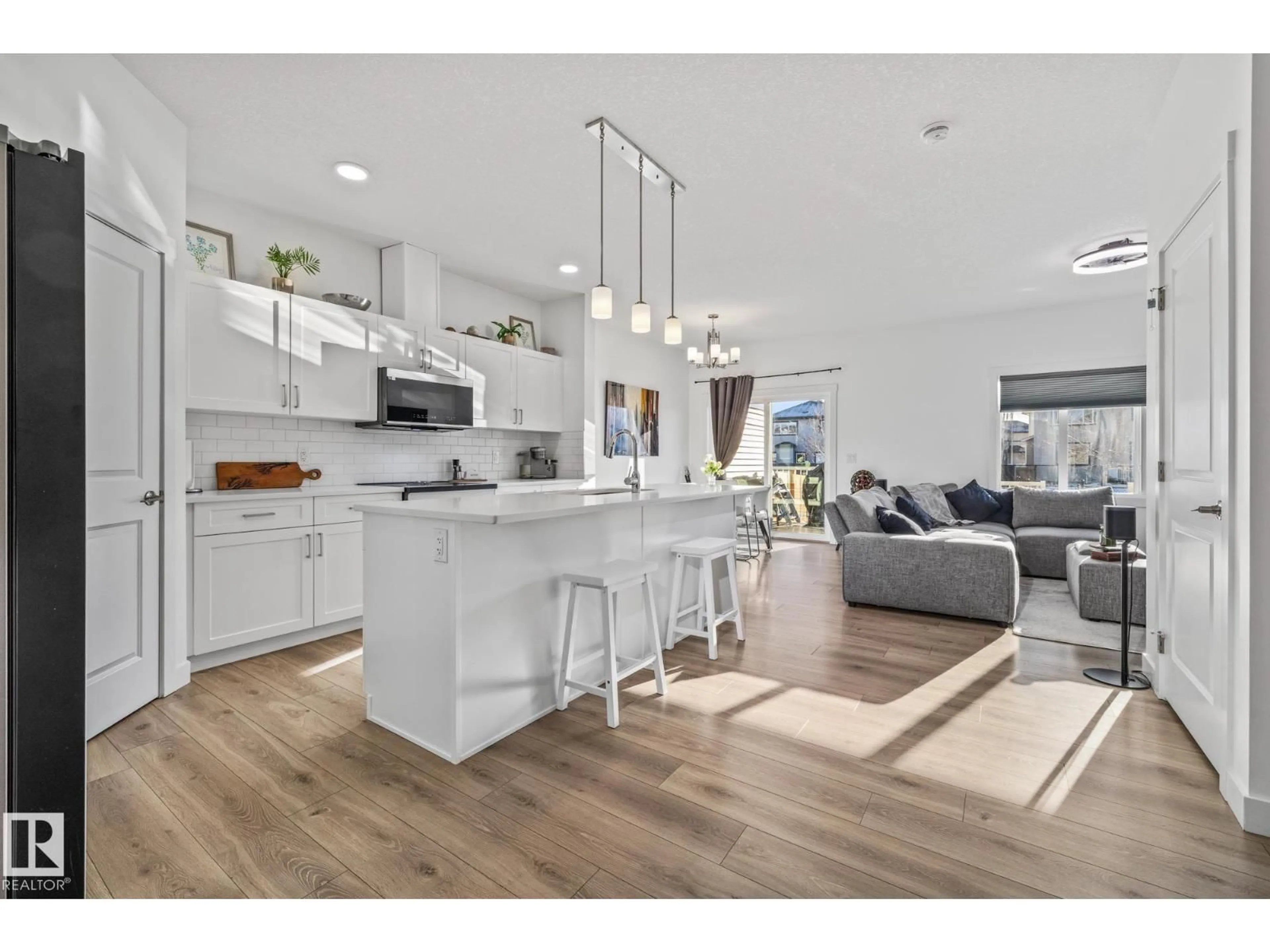 Open concept kitchen, wood/laminate floor for 109 ELM ST, Fort Saskatchewan Alberta T6M1M2