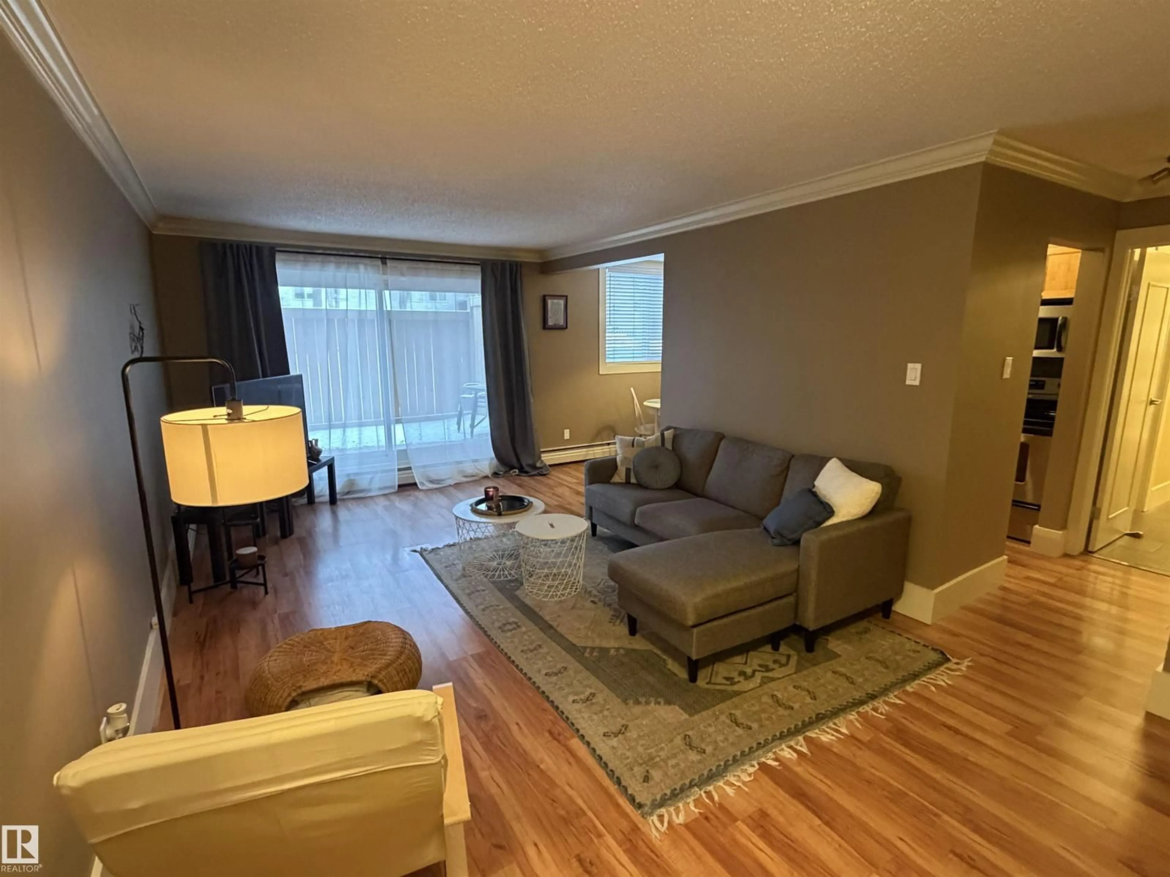 Living room with furniture, wood/laminate floor for #102 - 11303 103 AV, Edmonton Alberta T5K1S1