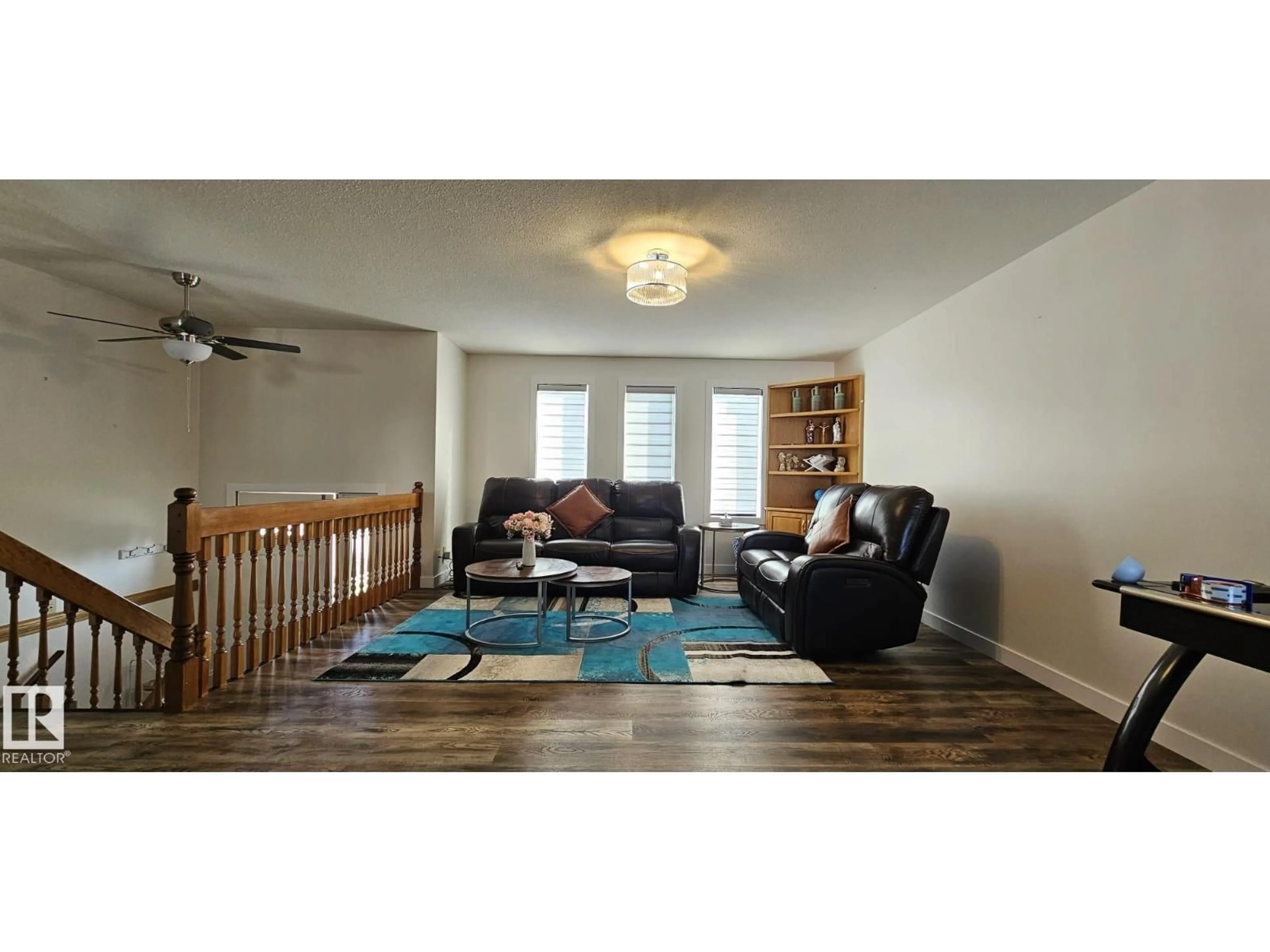 Living room with furniture, wood/laminate floor for 4514 56 AV, Barrhead Alberta T7N1K6