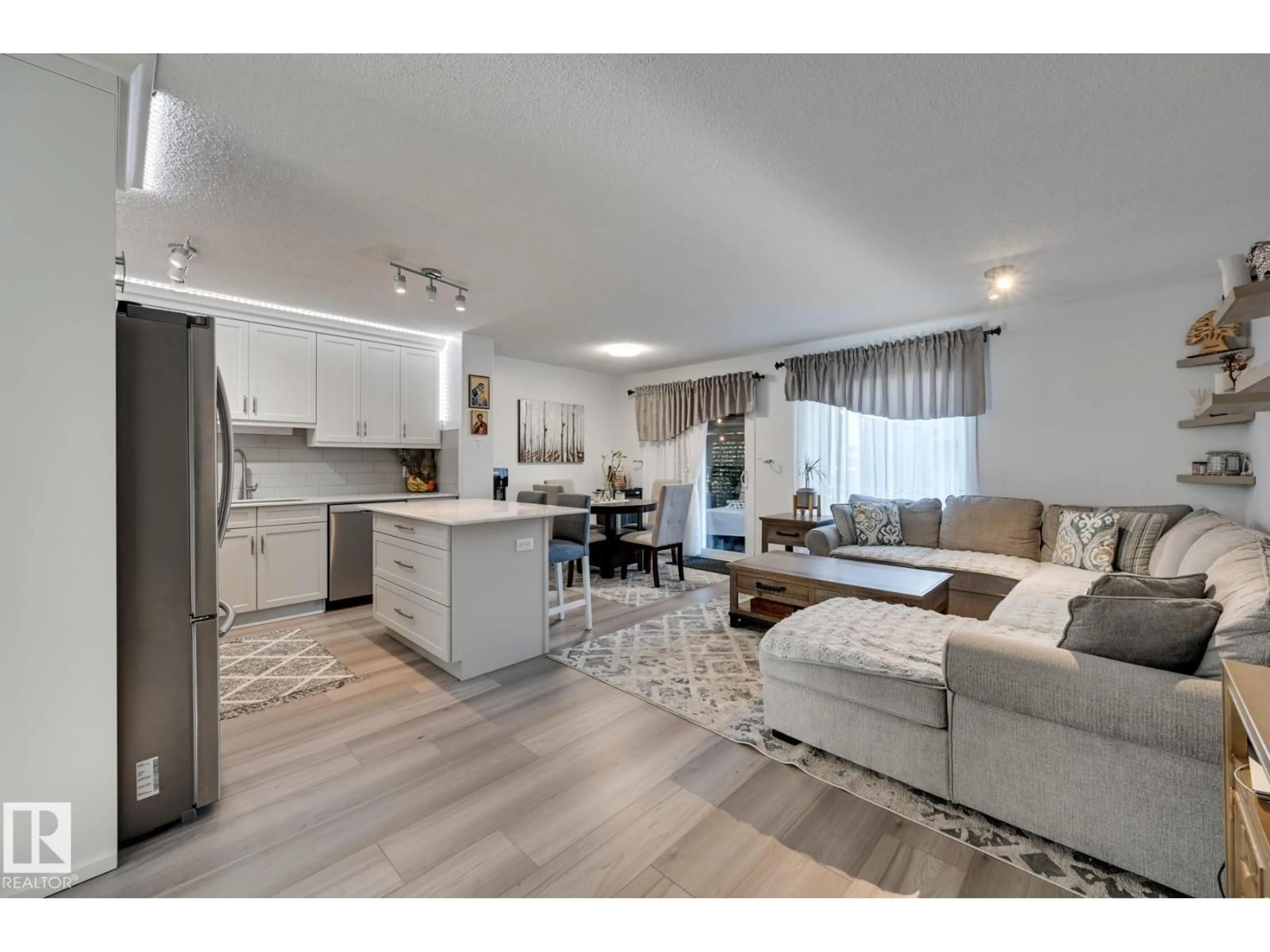 Open concept kitchen, wood/laminate floor for 14803 - 59 MILLER BV, Edmonton Alberta T5Y3A4
