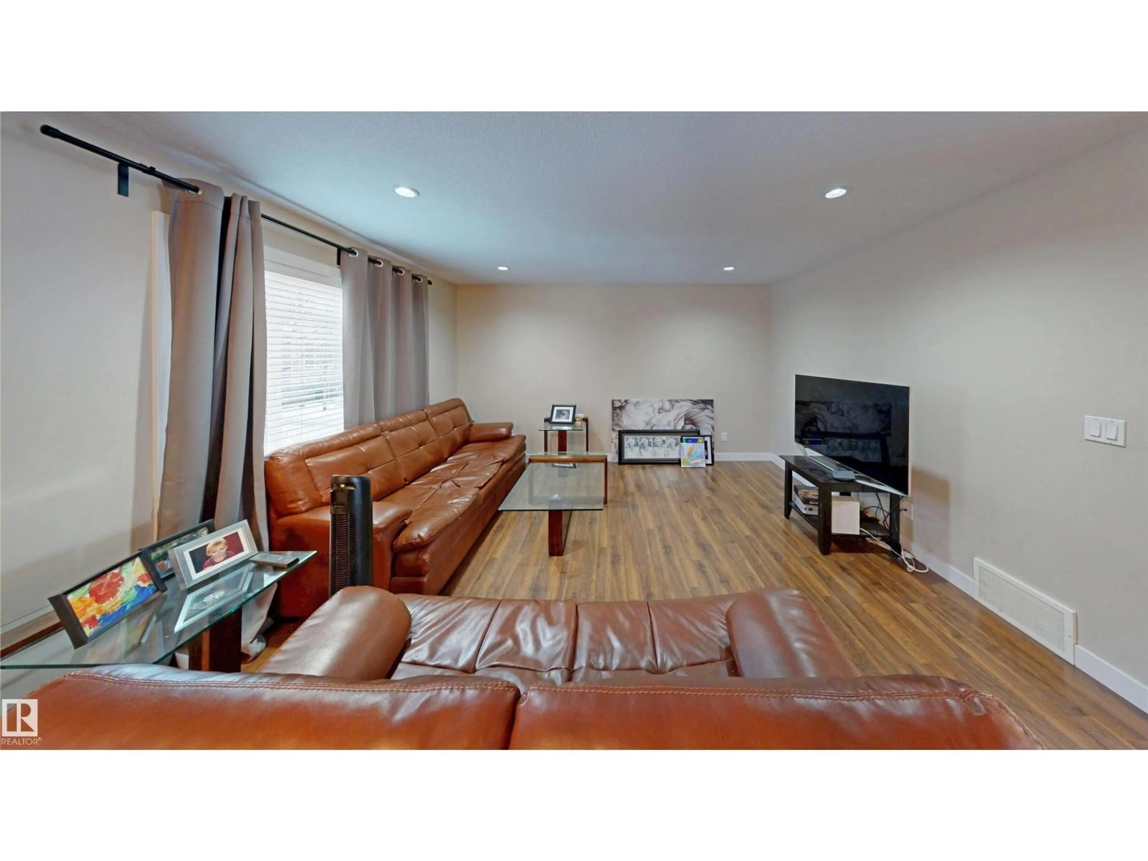 Living room with furniture, wood/laminate floor for #90 - 9535 217 ST, Edmonton Alberta T5J4P5