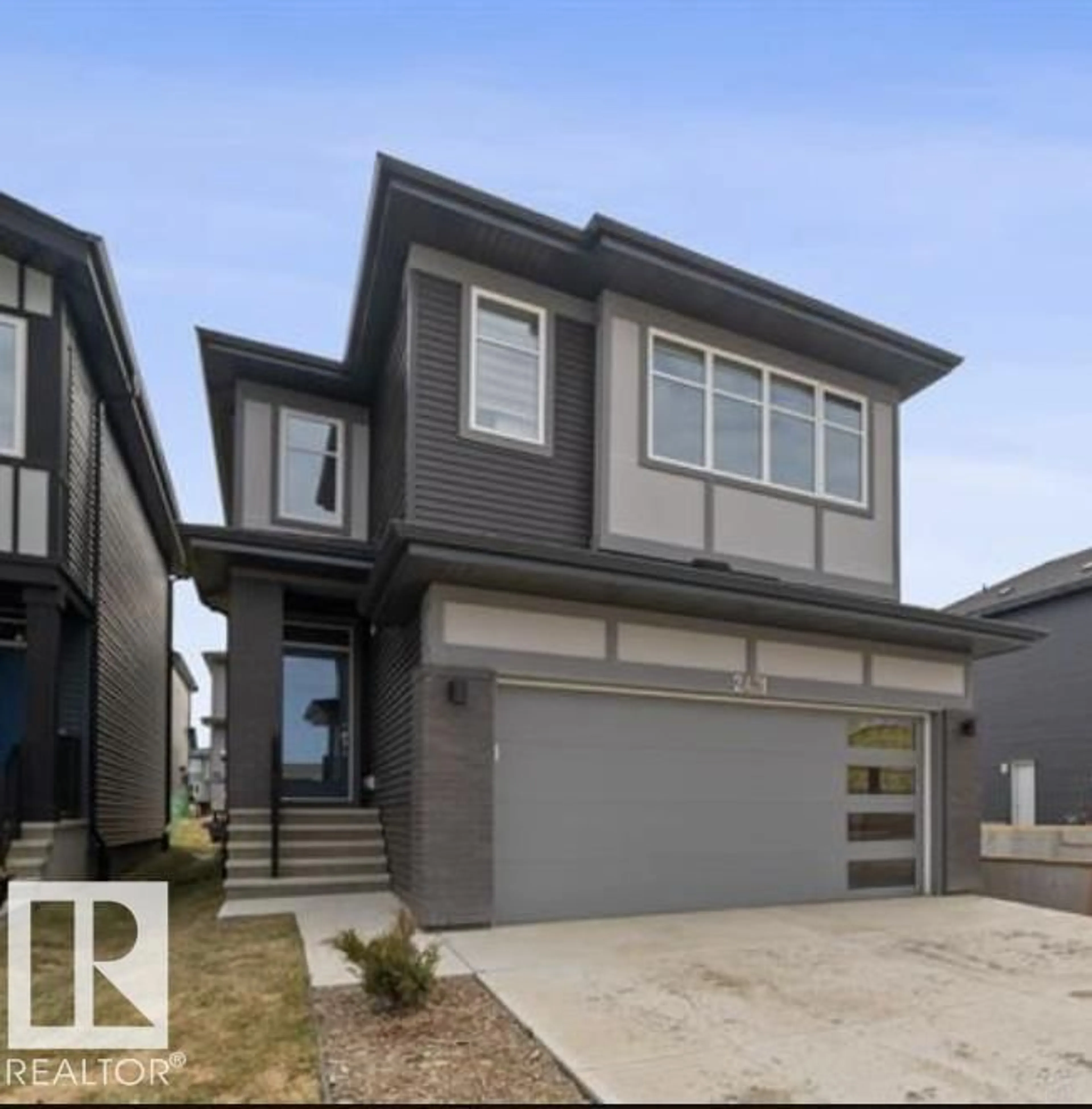Home with vinyl exterior material, street for NW - 2431 207 ST, Edmonton Alberta T6M1P1