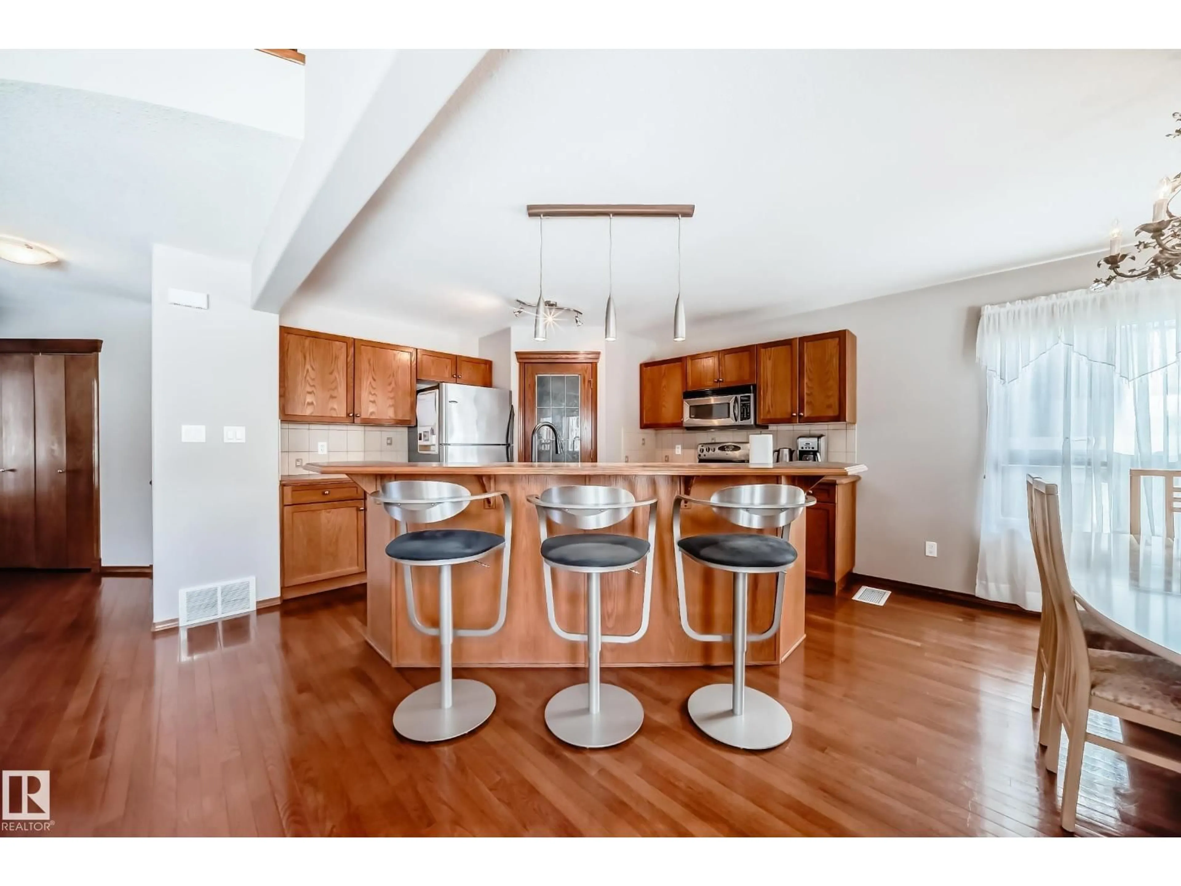 Open concept kitchen, wood/laminate floor for NW - 17036 119 ST, Edmonton Alberta T5X6H8