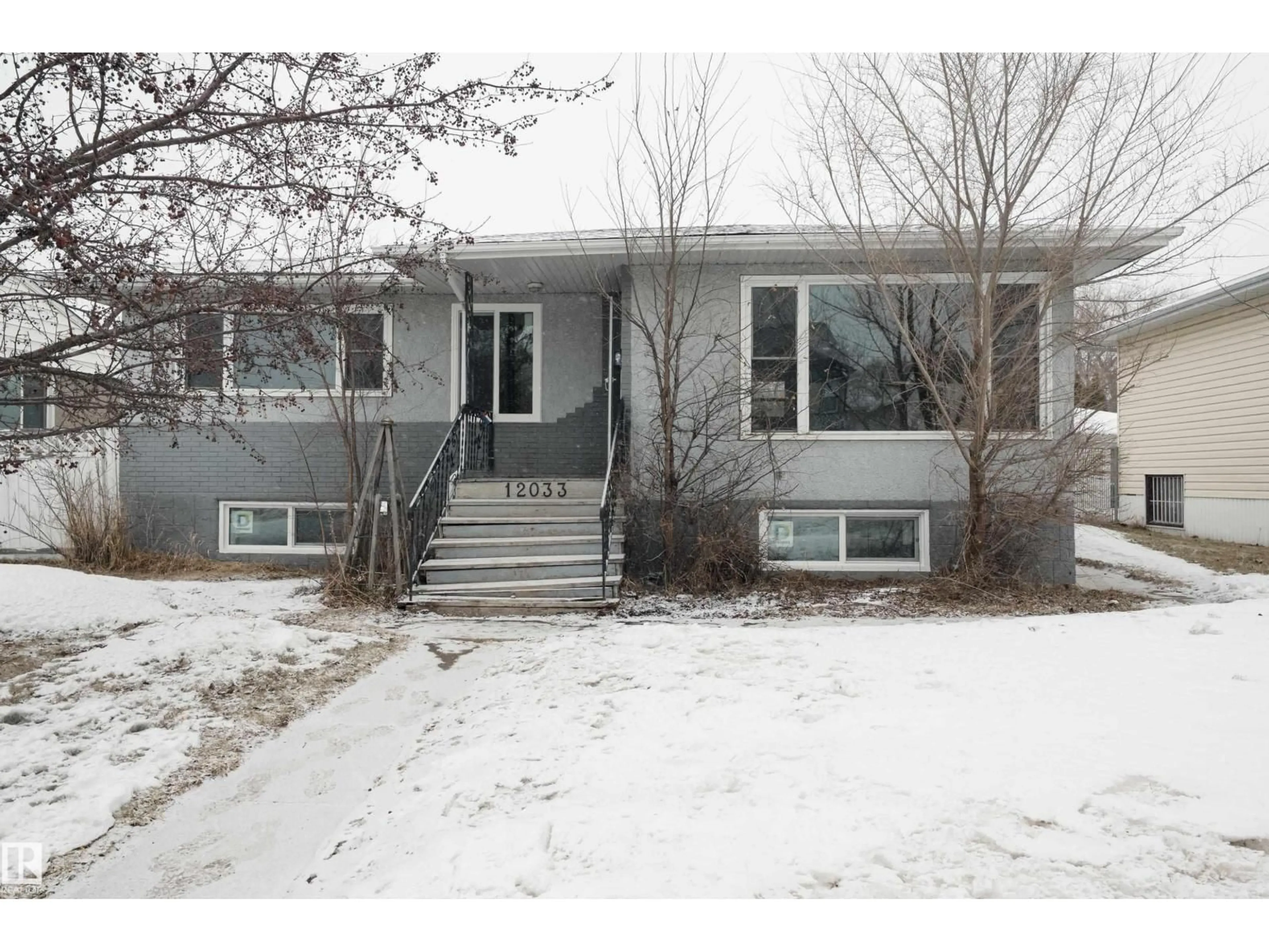 Home with vinyl exterior material, street for 12033 54 ST, Edmonton Alberta T5W3N2