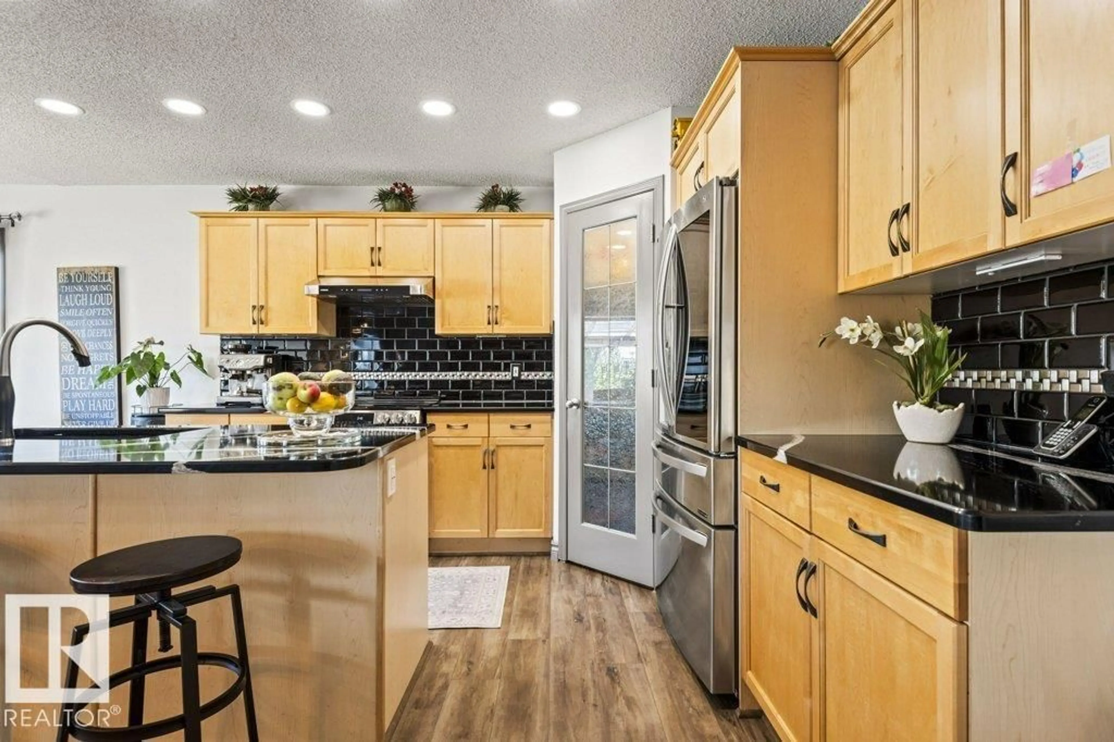 Open concept kitchen, ceramic/tile floor for 16820 57 ST, Edmonton Alberta T5Y0K4