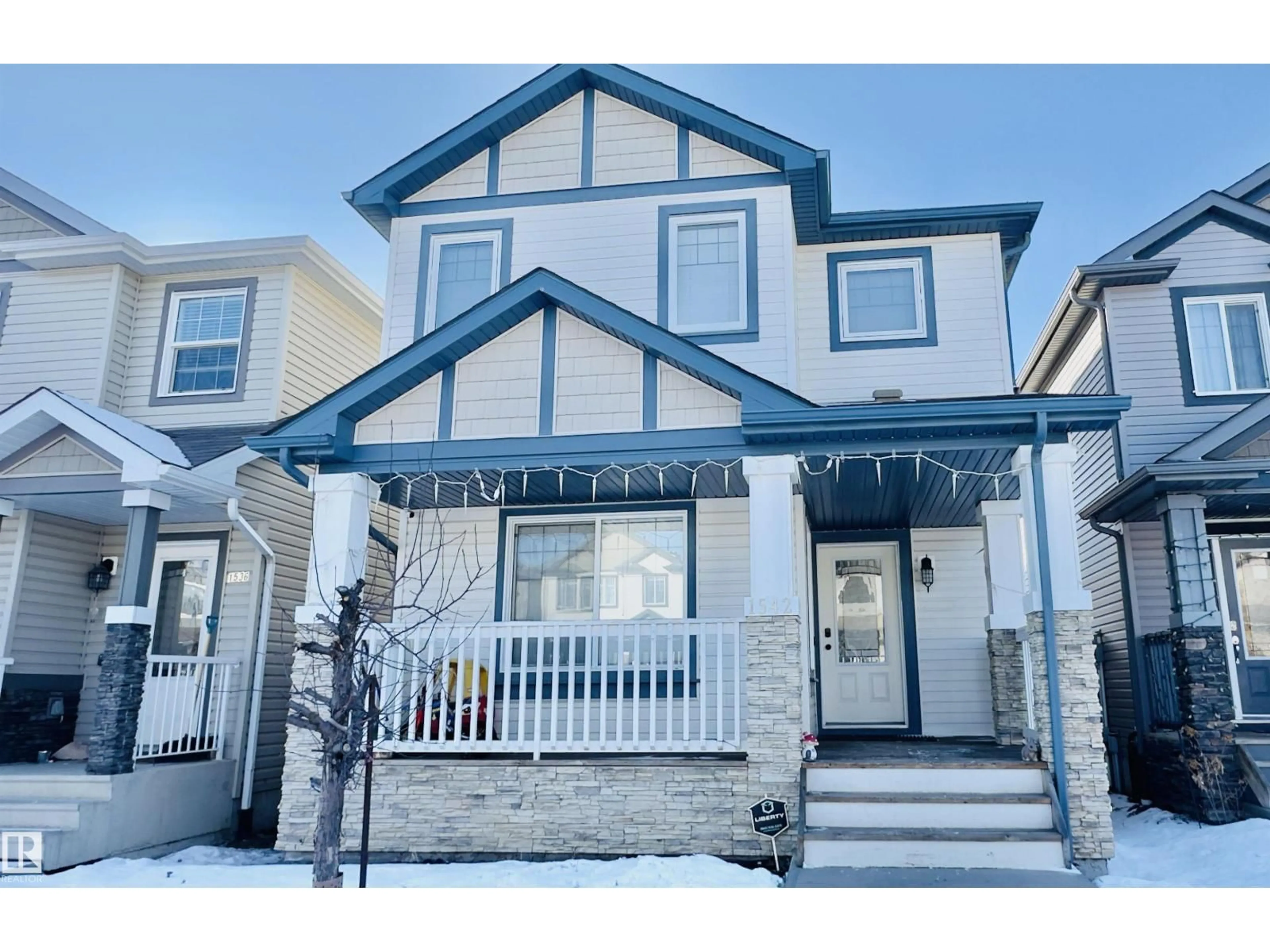 Home with vinyl exterior material, street for NW - 1542 33A ST, Edmonton Alberta T6T0X5