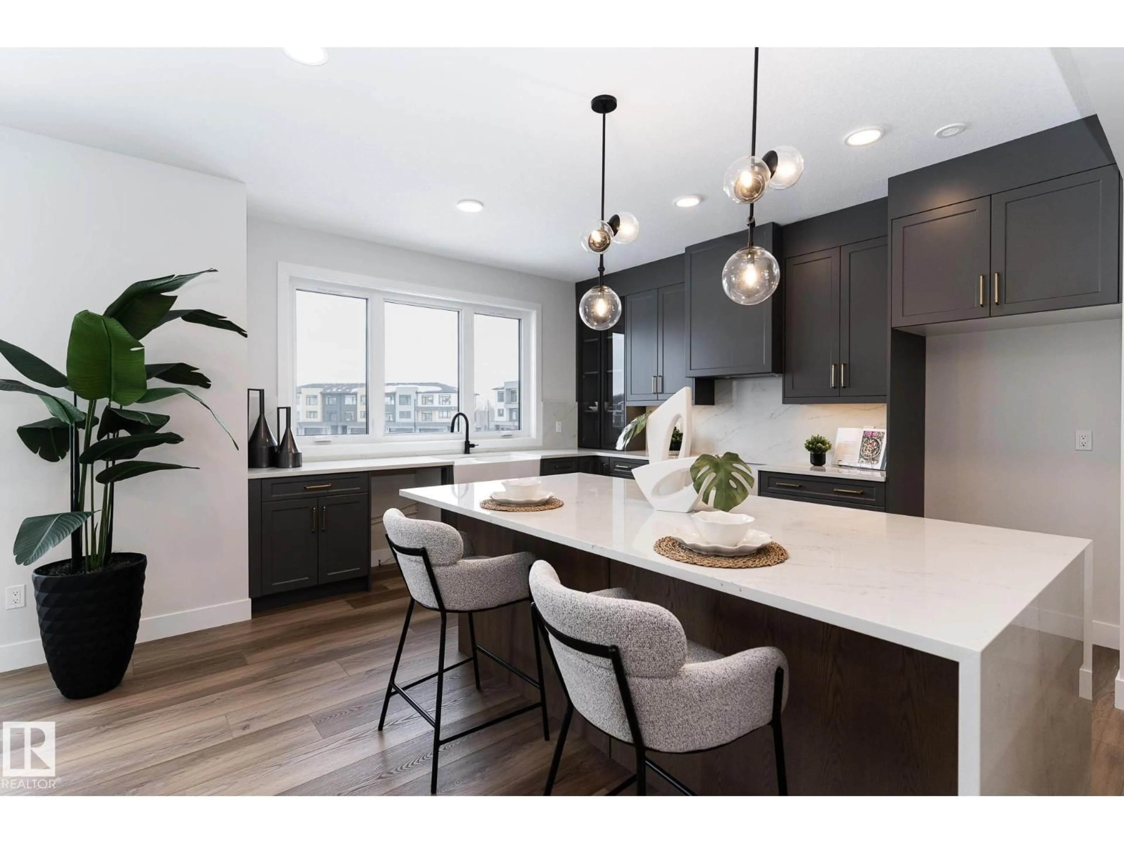 Open concept kitchen, wood/laminate floor for 7121 - 25 MAY CR, Edmonton Alberta T6R0X2