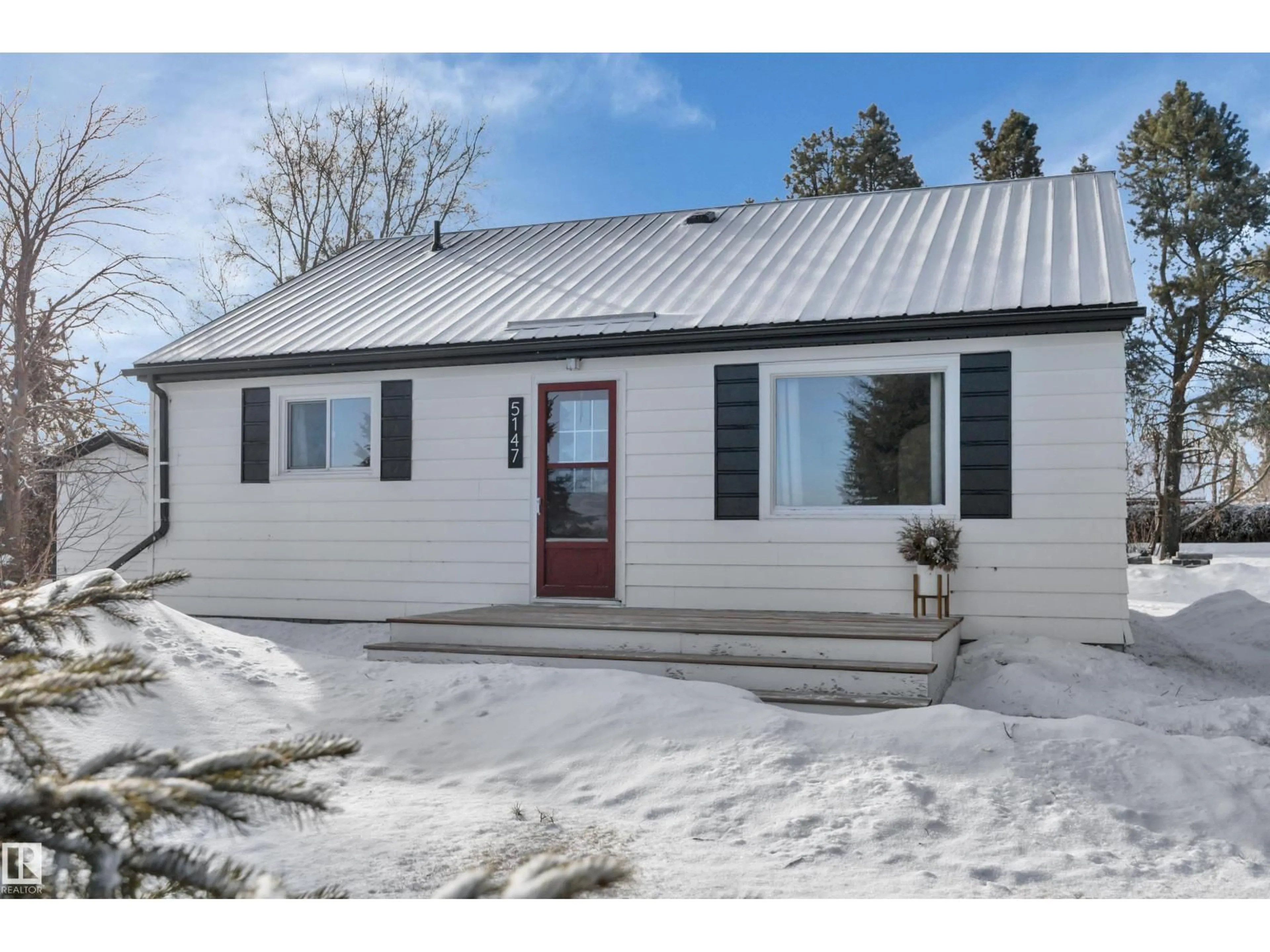 Home with vinyl exterior material, street for 5147 53 AV, Millet Alberta T0C1Z0