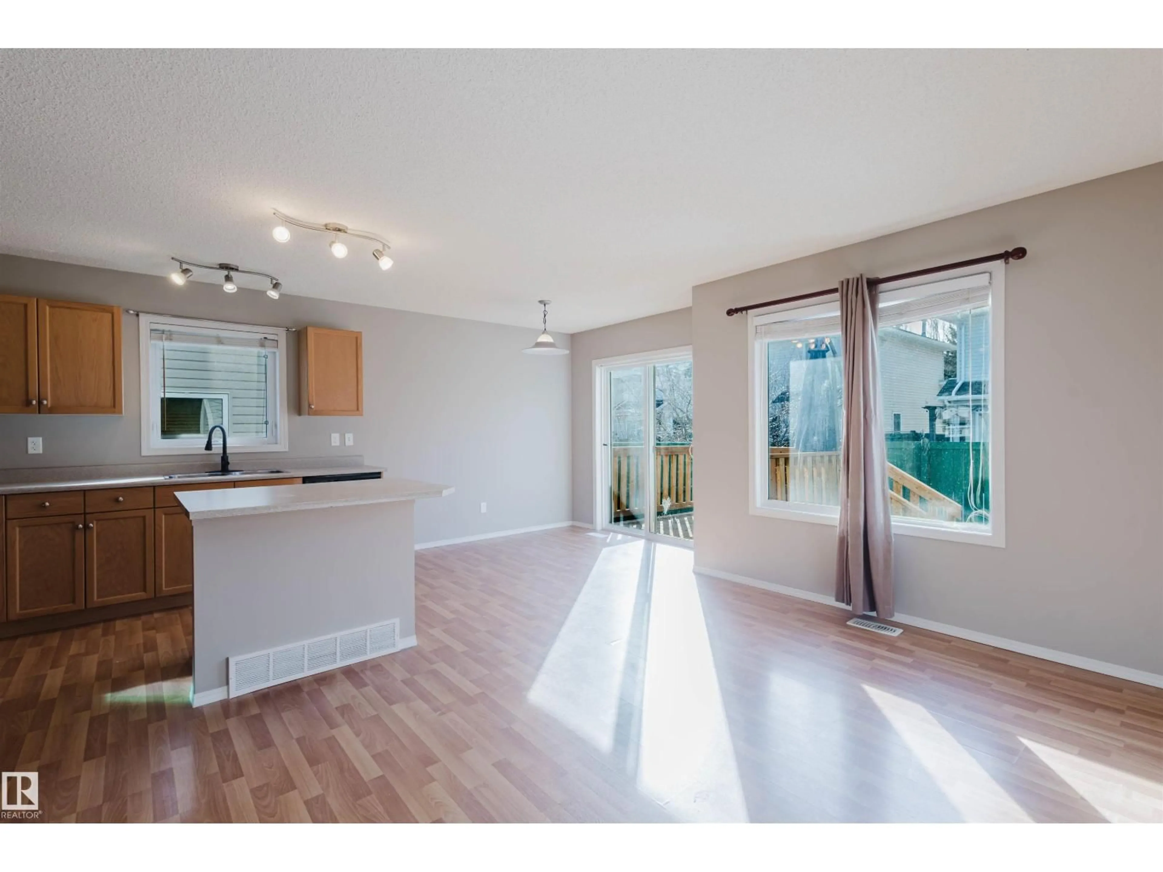 Open concept kitchen, wood/laminate floor for 29 115 CHESTERMERE DR, Sherwood Park Alberta T8H2W4