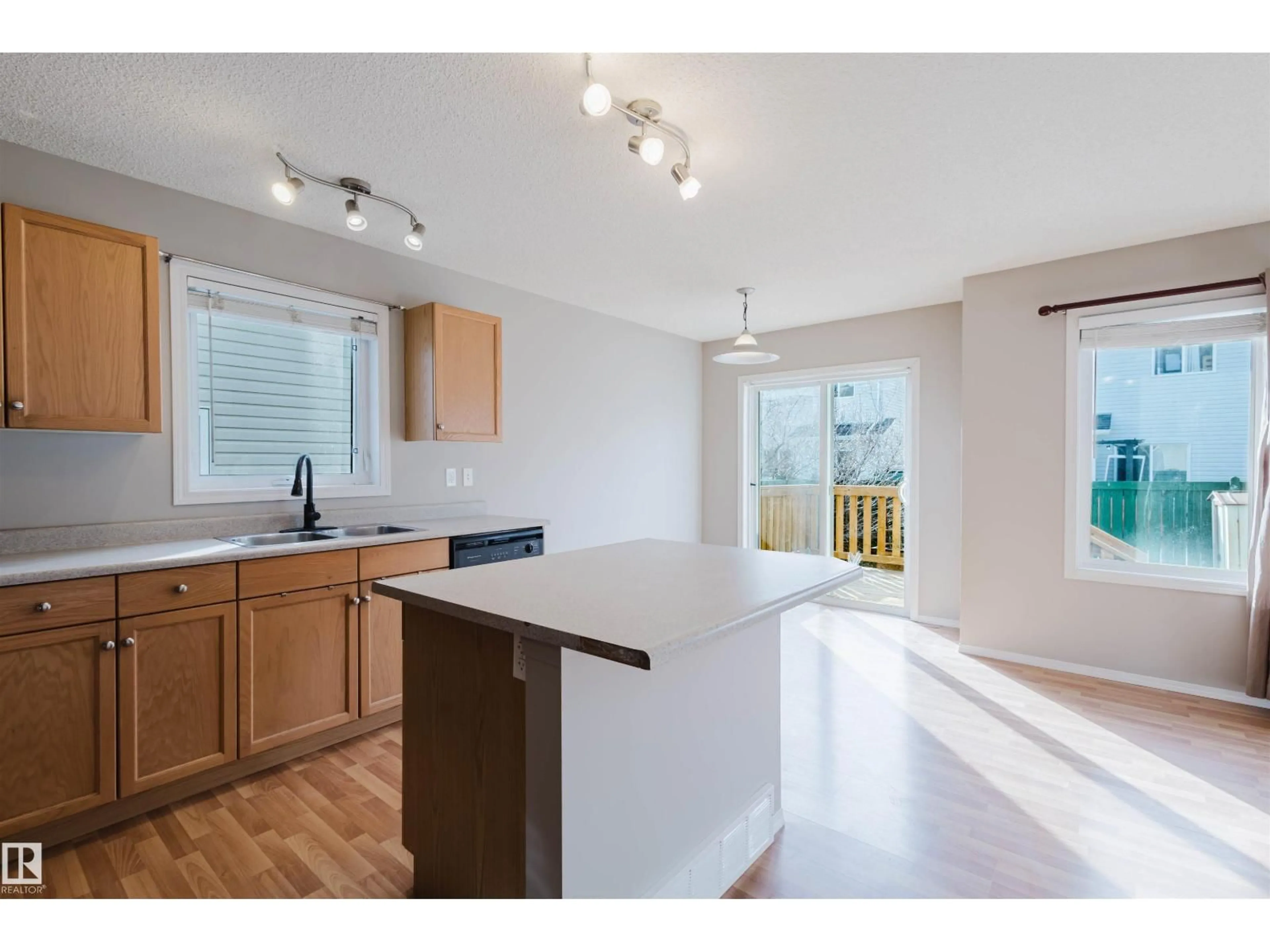 Open concept kitchen, wood/laminate floor for 29 115 CHESTERMERE DR, Sherwood Park Alberta T8H2W4