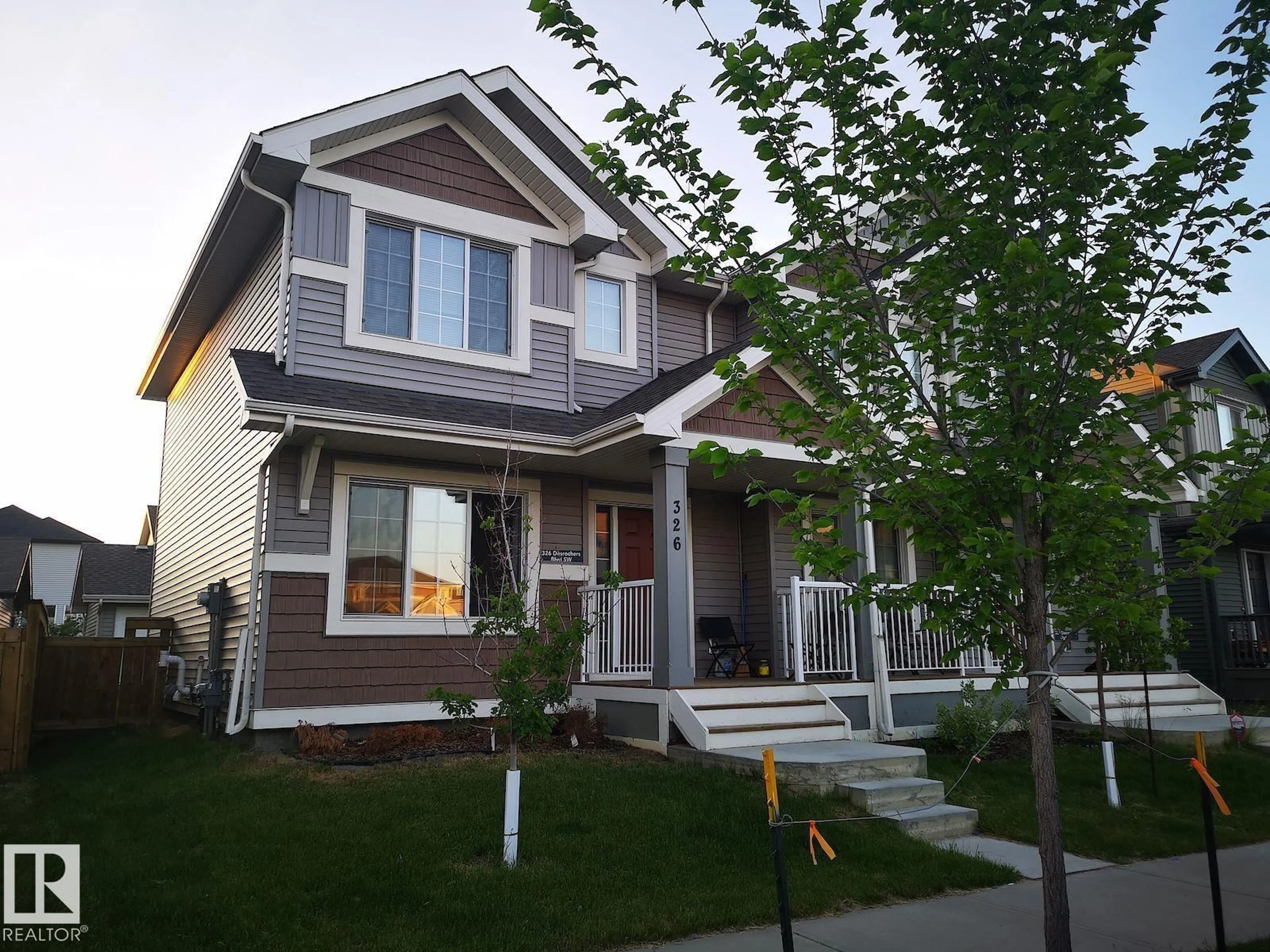 Home with vinyl exterior material, street for 326 DESROCHERS BV, Edmonton Alberta T6W3J1