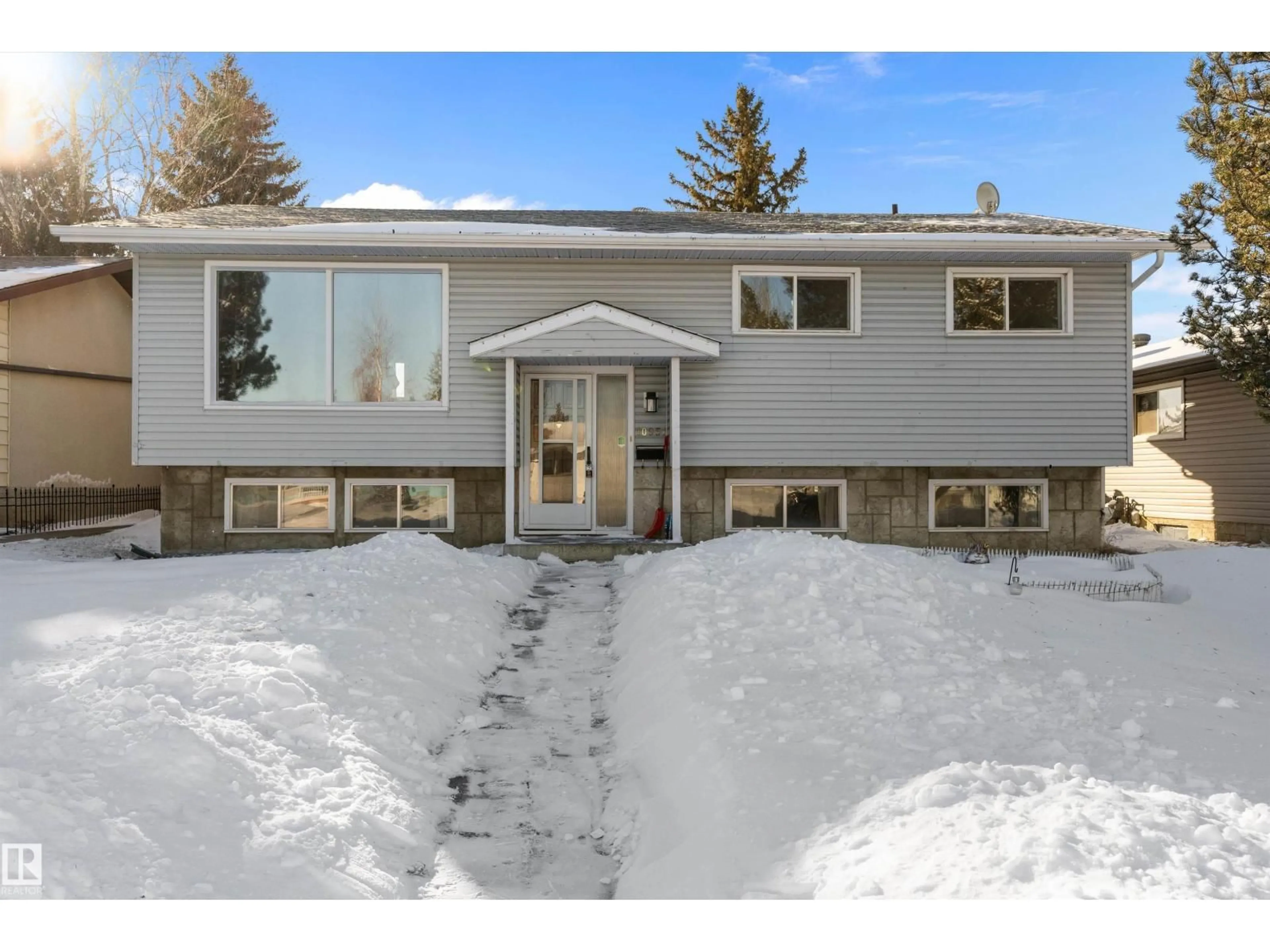 Home with vinyl exterior material, street for 10951 35A AV, Edmonton Alberta T6J0A2