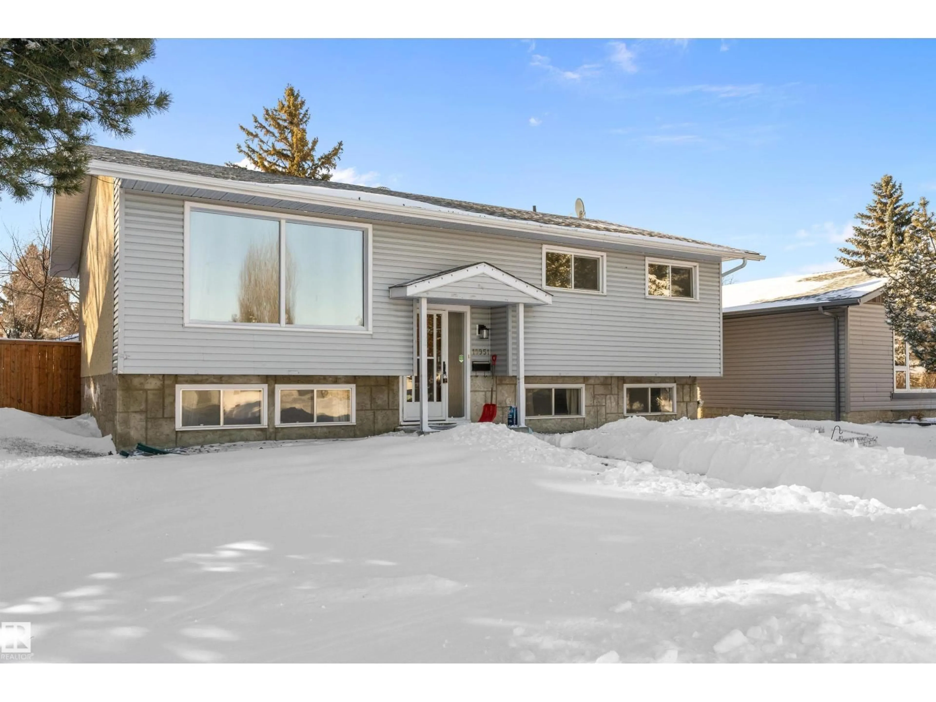 Home with vinyl exterior material, street for 10951 35A AV, Edmonton Alberta T6J0A2