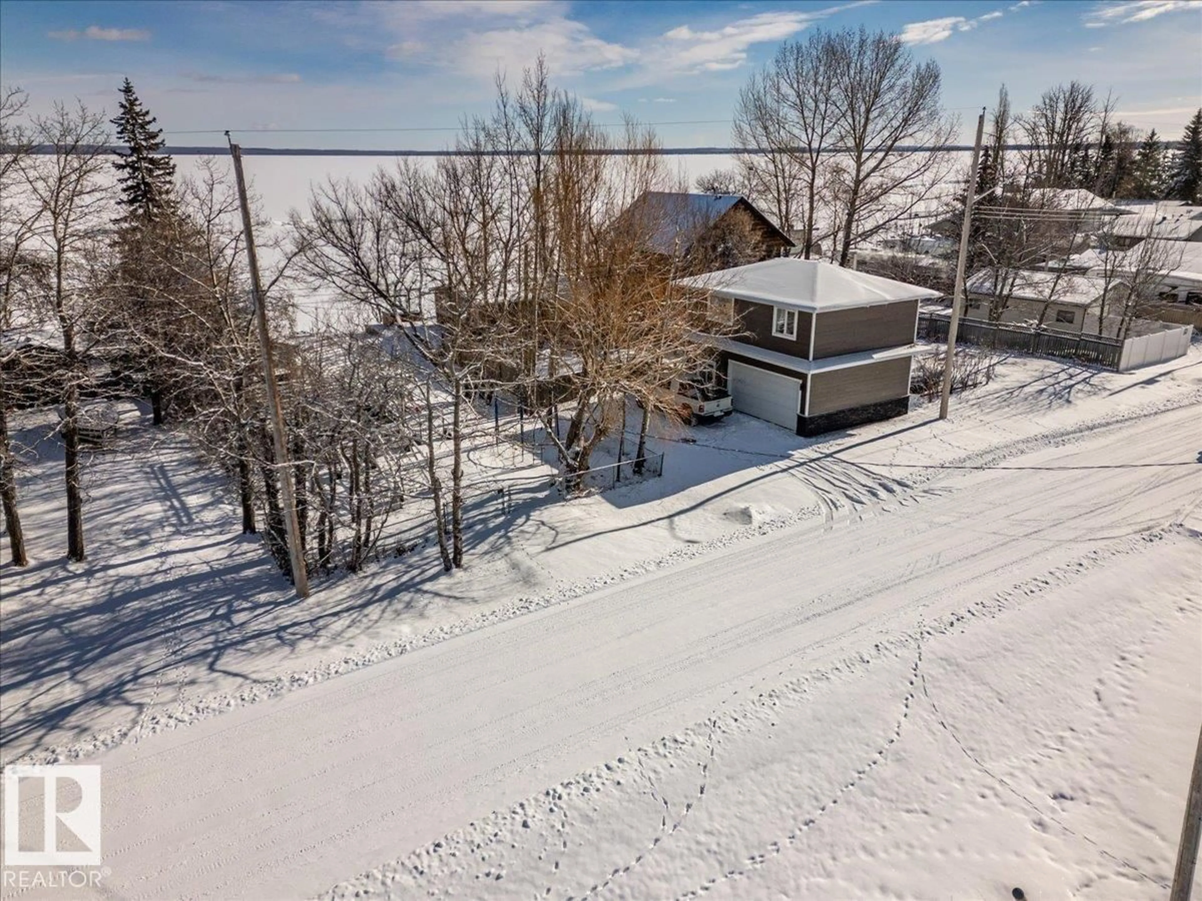 A pic from outside/outdoor area/front of a property/back of a property/a pic from drone, water/lake/river/ocean view for 17 LAKESHORE DR, Rural Wetaskiwin County Alberta T0C2V0