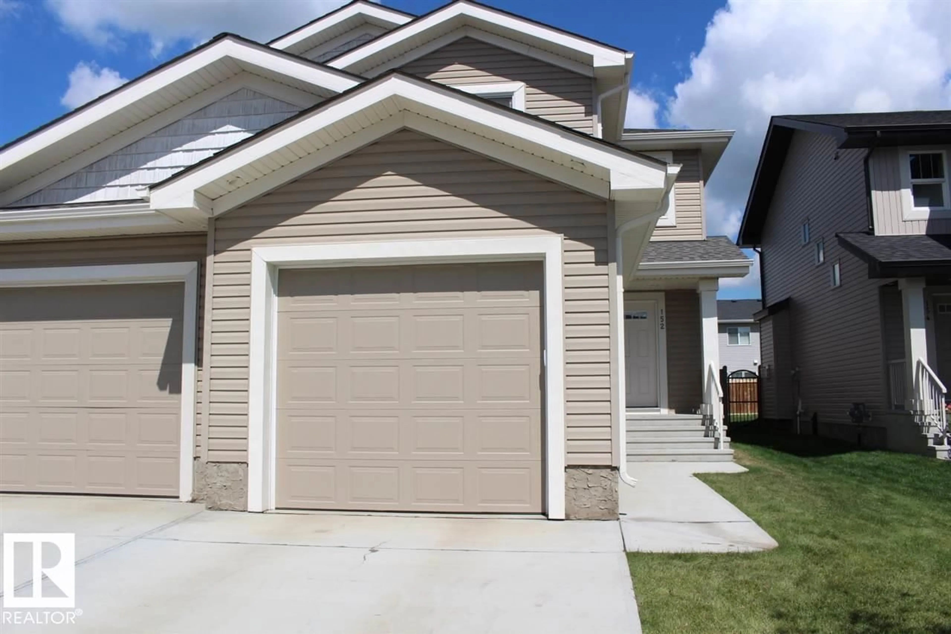 Home with vinyl exterior material, street for 152 RADCLIFFE WD, Fort Saskatchewan Alberta T8L0S9