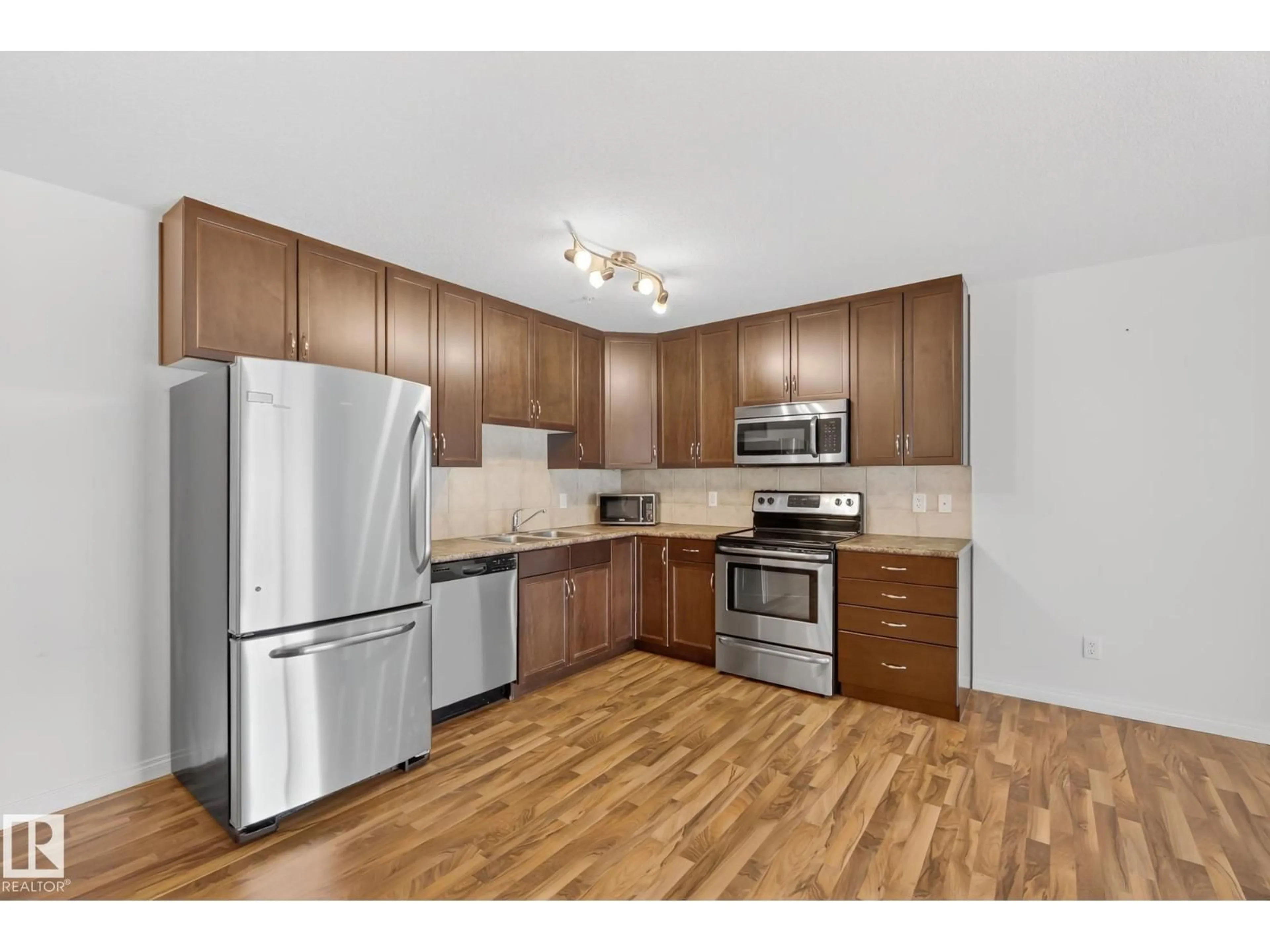 Standard kitchen, wood/laminate floor for #216 - 1204 156 ST NW, Edmonton Alberta T6R0R6