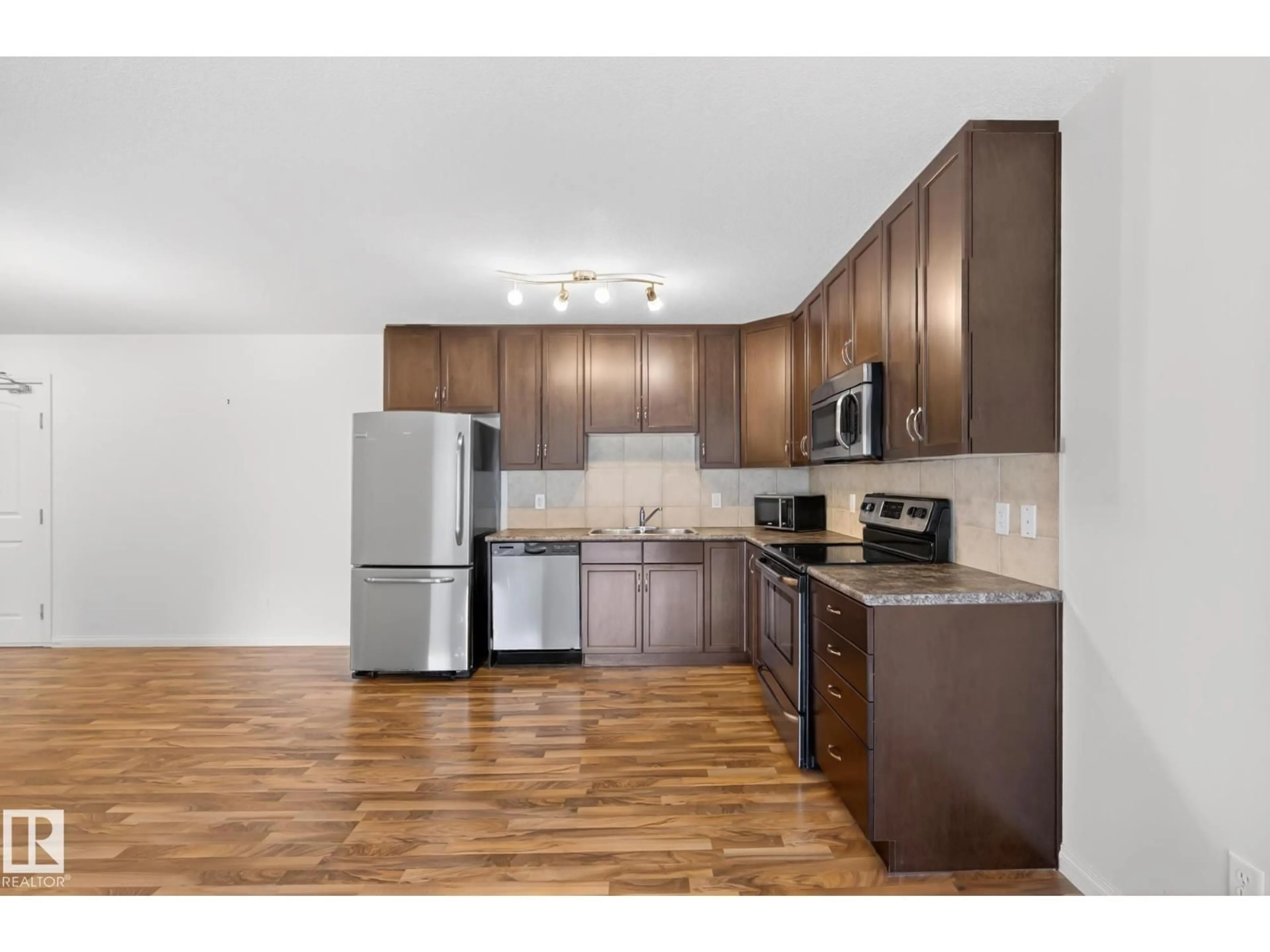 Standard kitchen, wood/laminate floor for #216 - 1204 156 ST NW, Edmonton Alberta T6R0R6