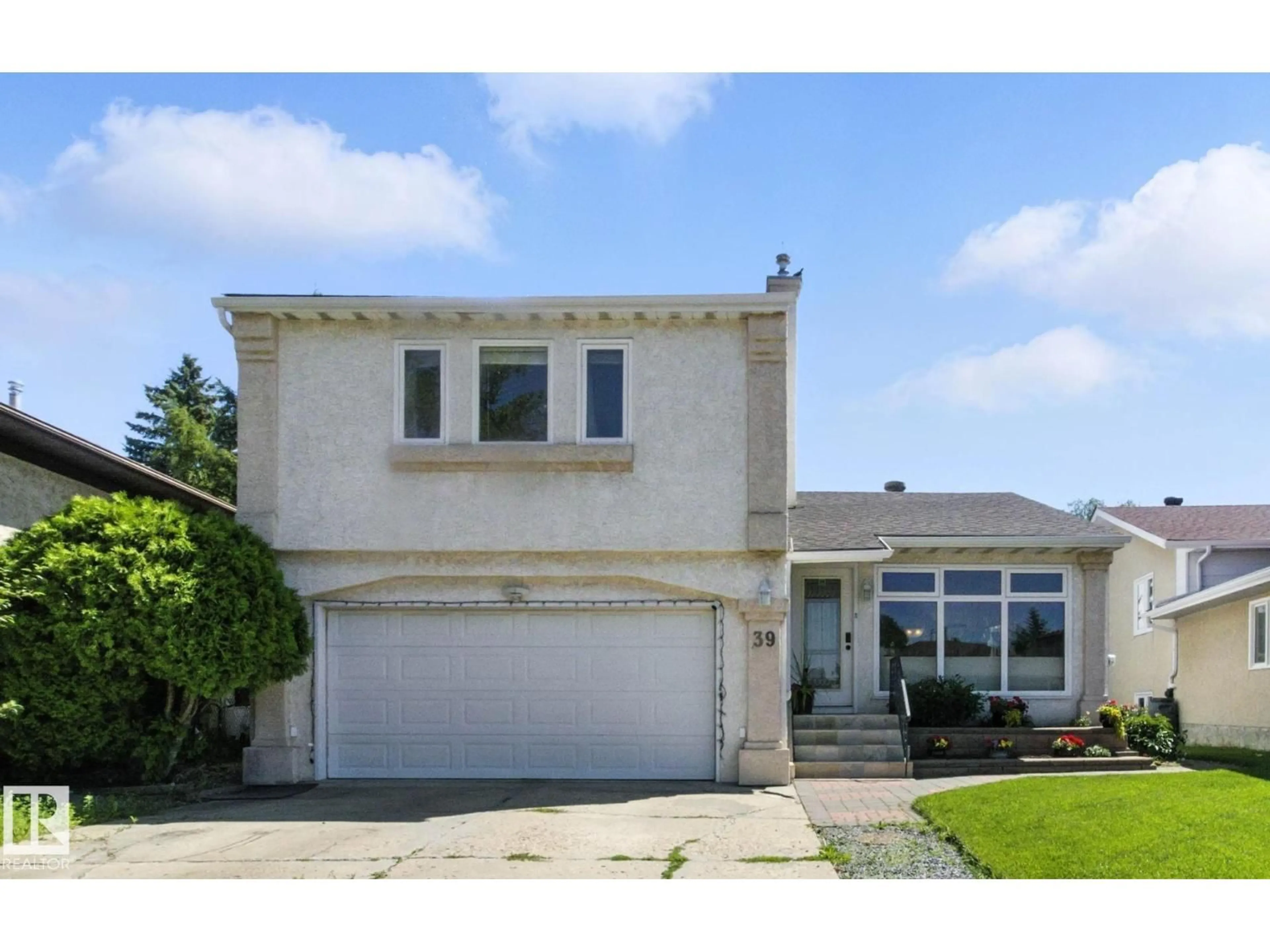 Home with vinyl exterior material, street for 39 GRAND MEADOW CR, Edmonton Alberta T6L1A3