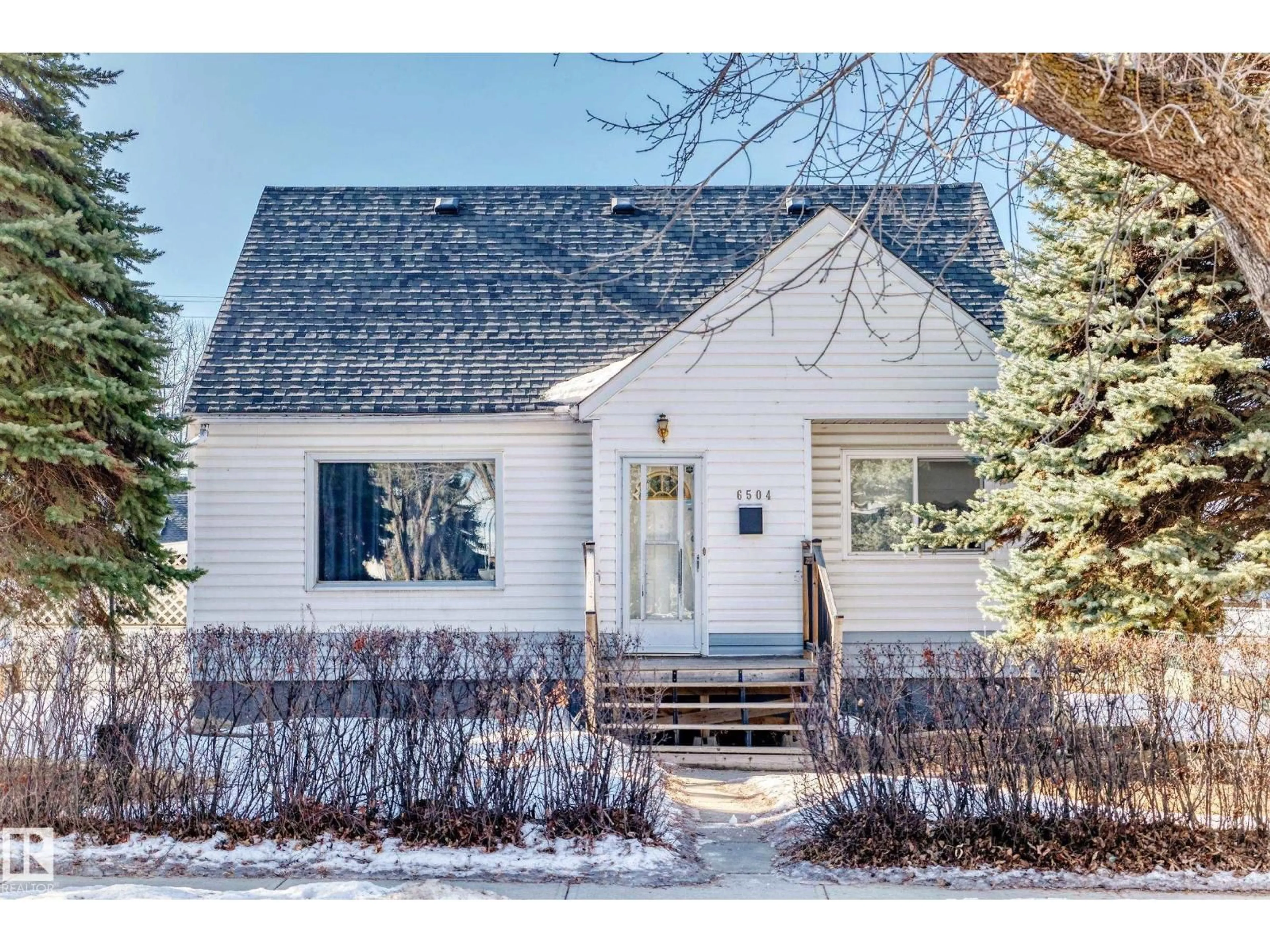 Home with vinyl exterior material, street for 6504 105 ST, Edmonton Alberta T6H1V3