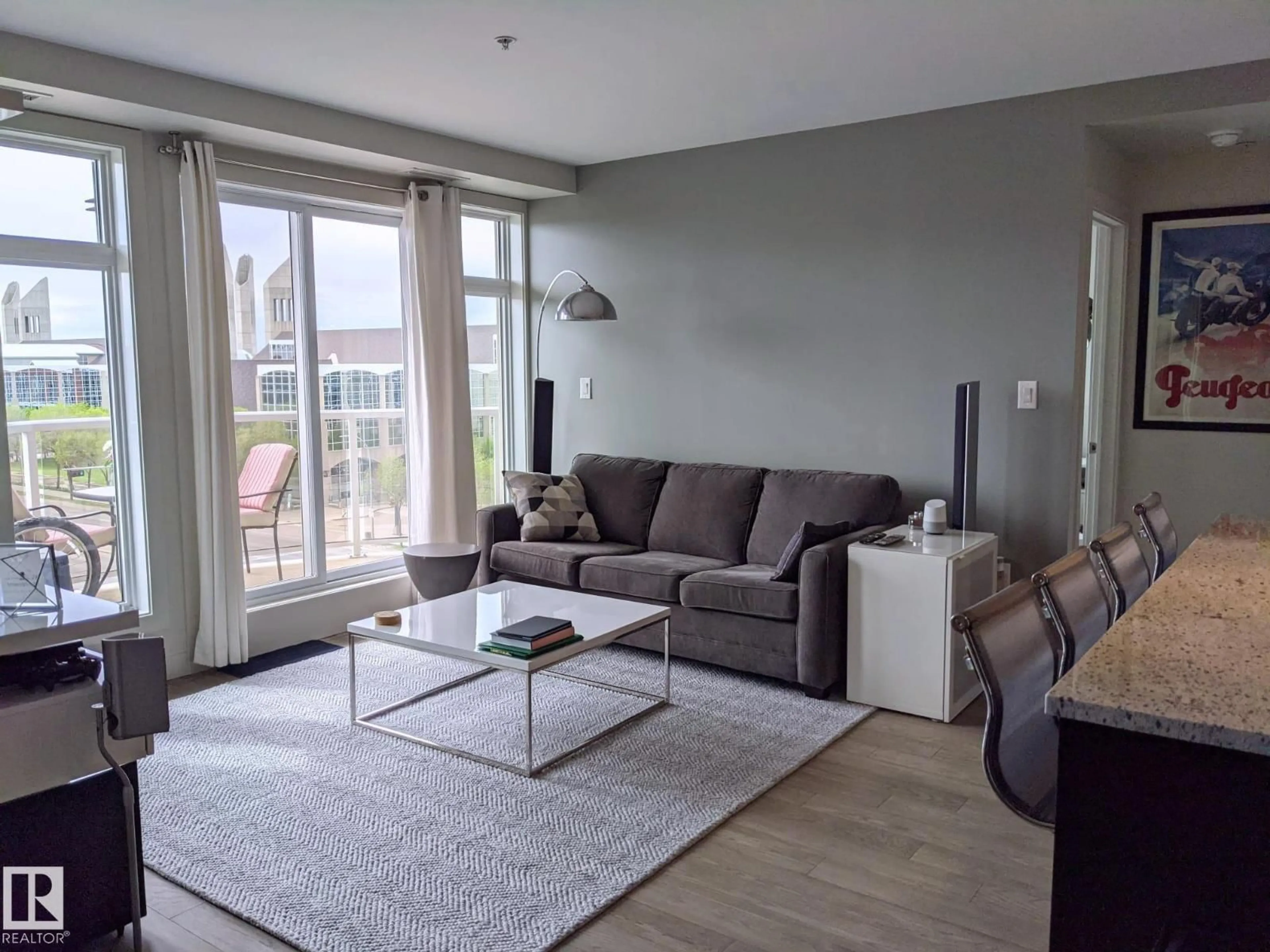 Living room with furniture, wood/laminate floor for 501 - 10388 105 ST NW, Edmonton Alberta T5J0C2