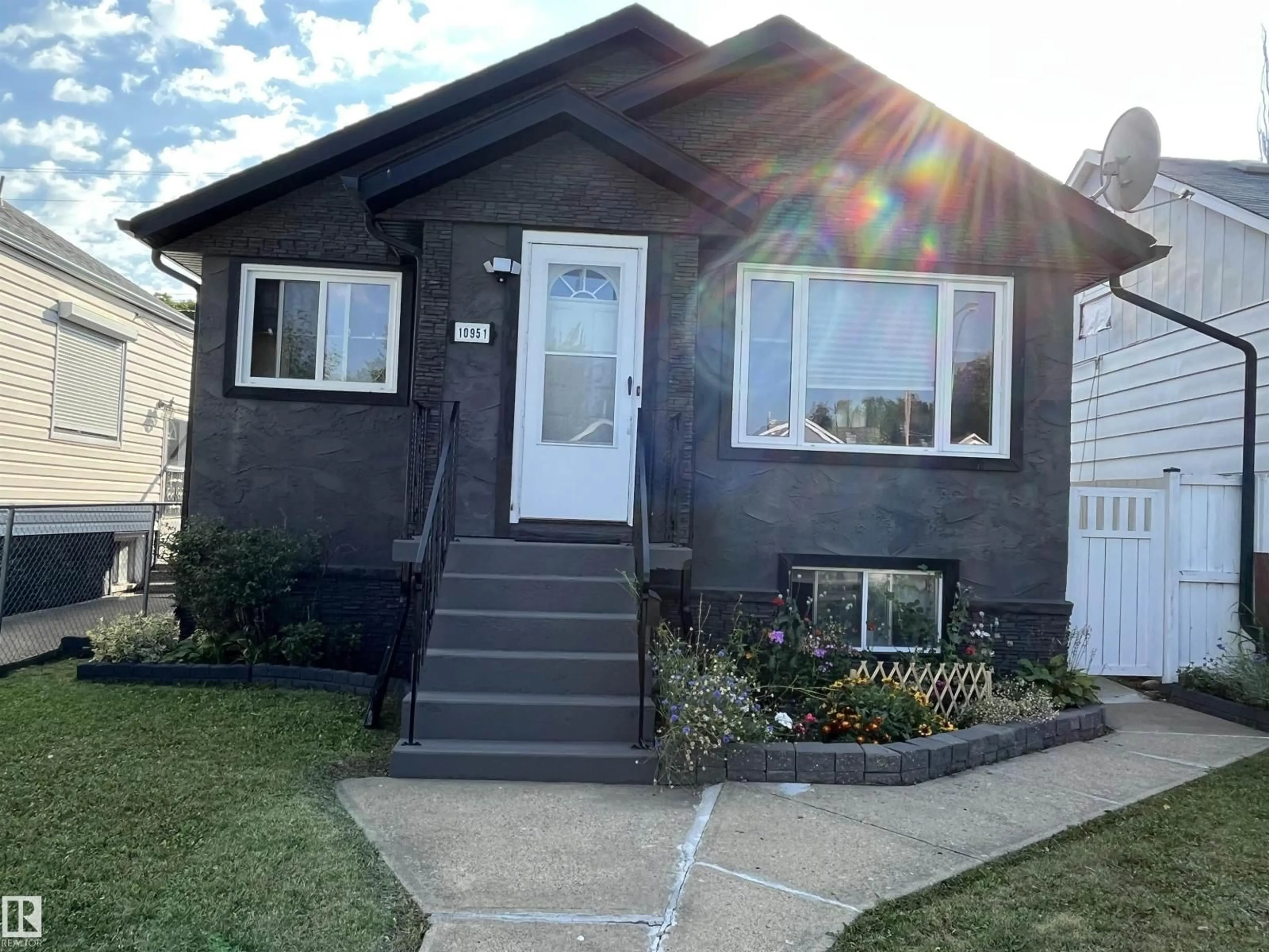 Home with vinyl exterior material, street for NW - 10951 96 ST, Edmonton Alberta T5H2K6
