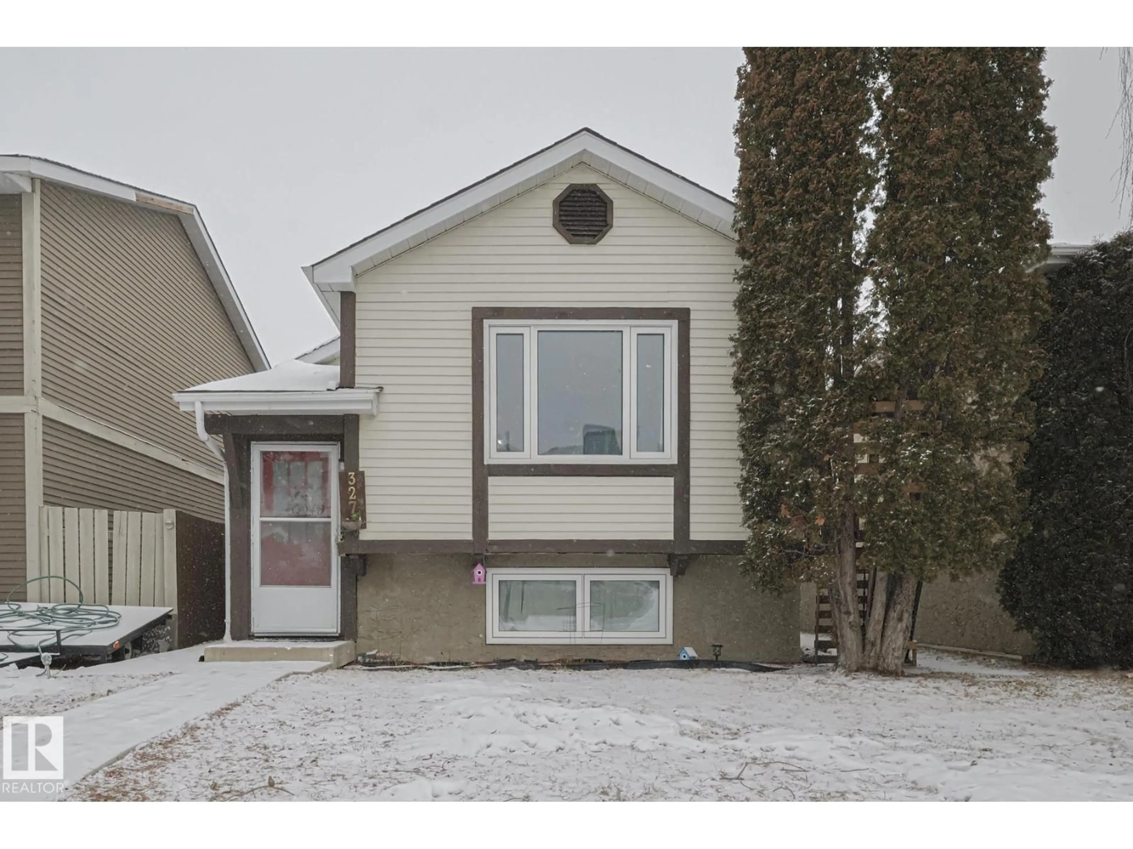 Home with vinyl exterior material, street for 327 KIRKPATRICK CR, Edmonton Alberta T6L5C9