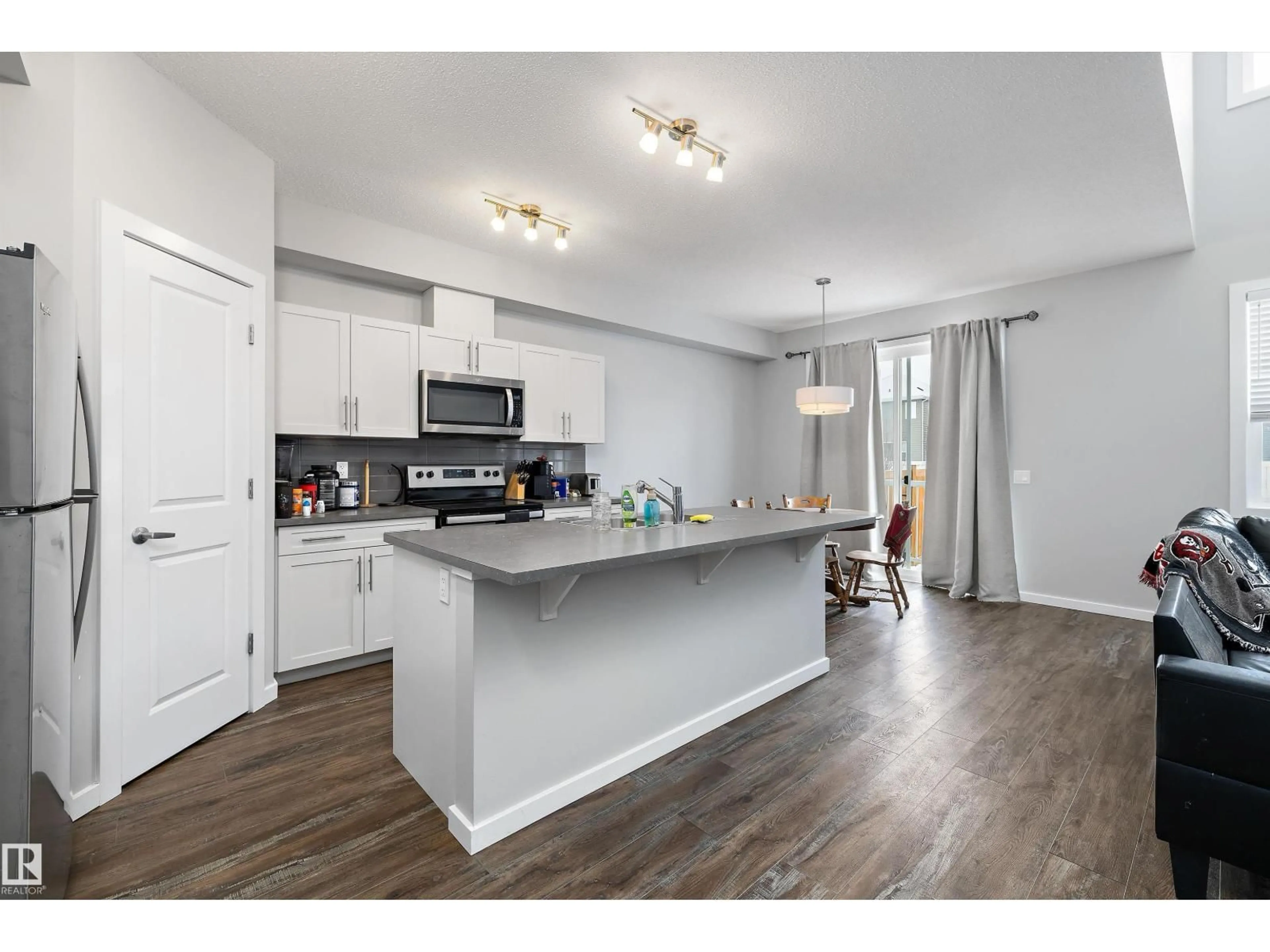 Open concept kitchen, wood/laminate floor for 7 STOUT PL, Leduc Alberta T9E1K4