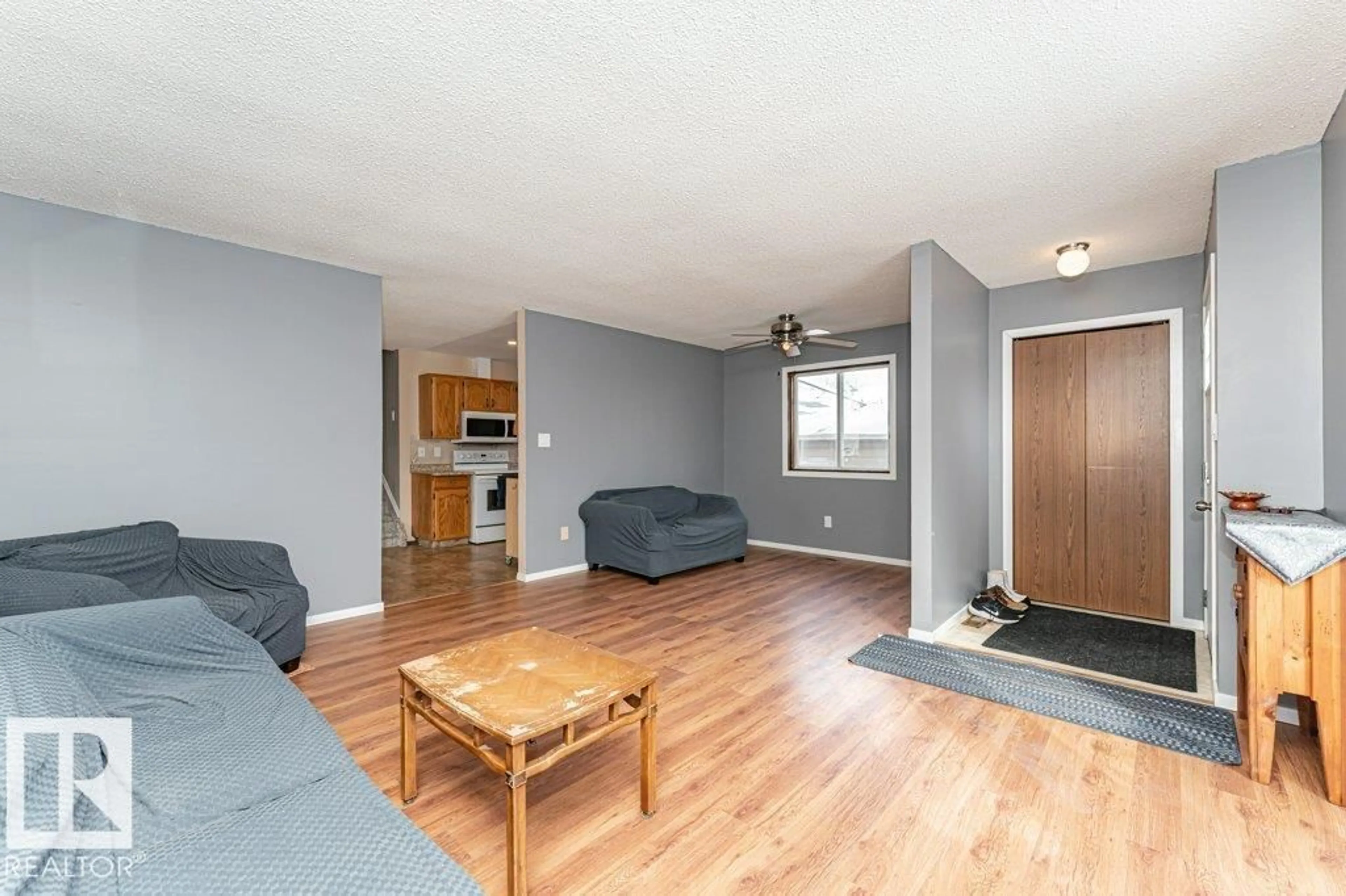 Living room with furniture, wood/laminate floor for 1028 45 ST, Edmonton Alberta T6L5Z5