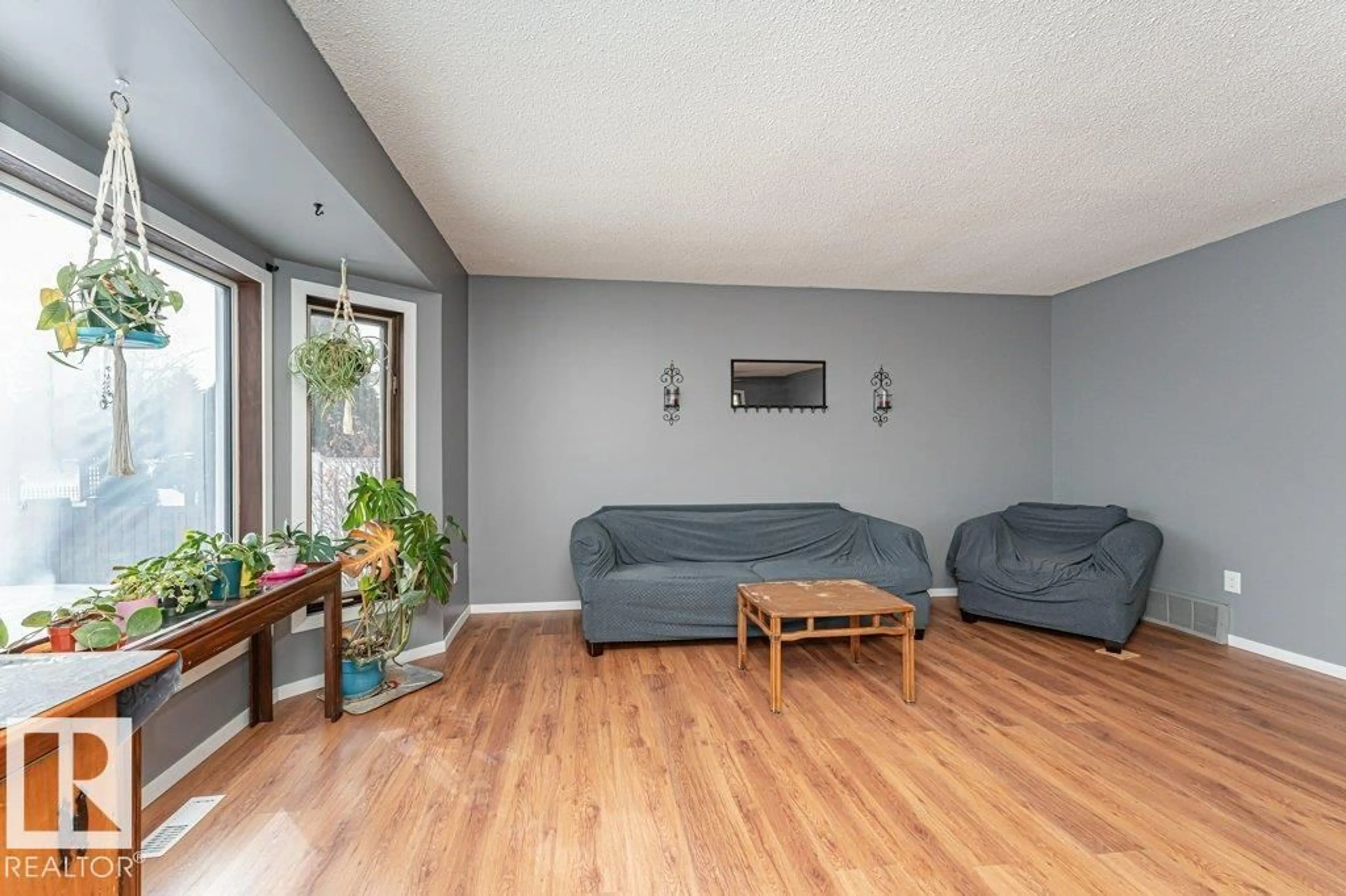 Living room with furniture, unknown for 1028 45 ST, Edmonton Alberta T6L5Z5