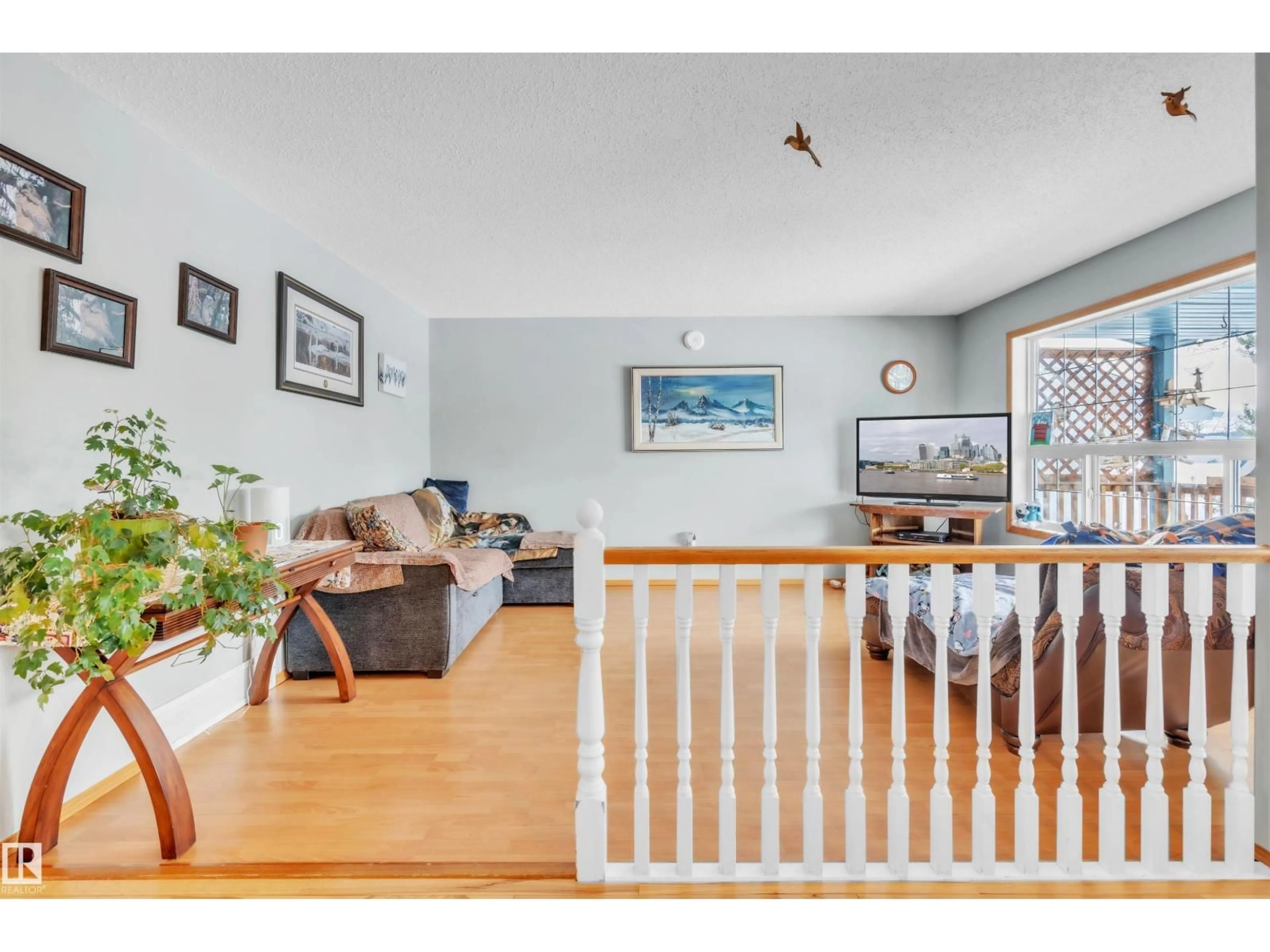 Living room with furniture, wood/laminate floor for 6108 51 AV, Cold Lake Alberta T9M1T6