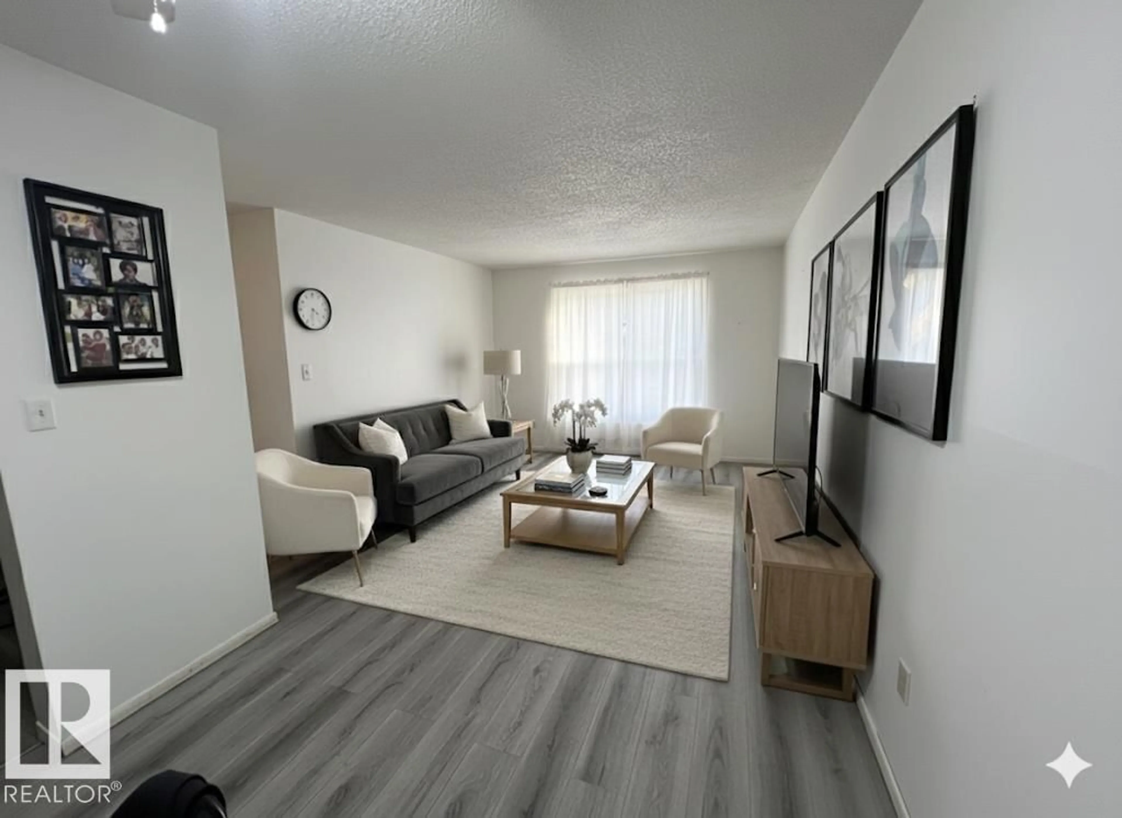 Living room with furniture, unknown for #212 - 2620 MILL WOODS RD E, Edmonton Alberta T6L5K6