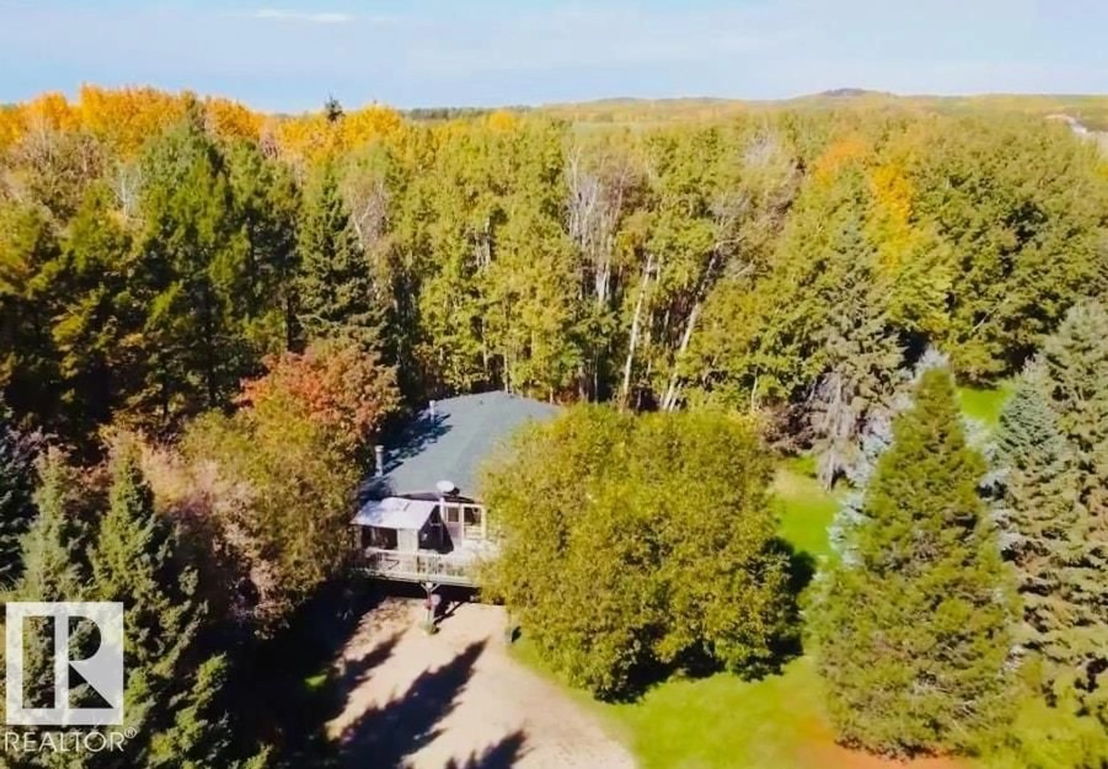 A pic from outside/outdoor area/front of a property/back of a property/a pic from drone, forest/trees view for 53512 - 10 HGHWAY 779, Rural Parkland County Alberta T7Y0A2