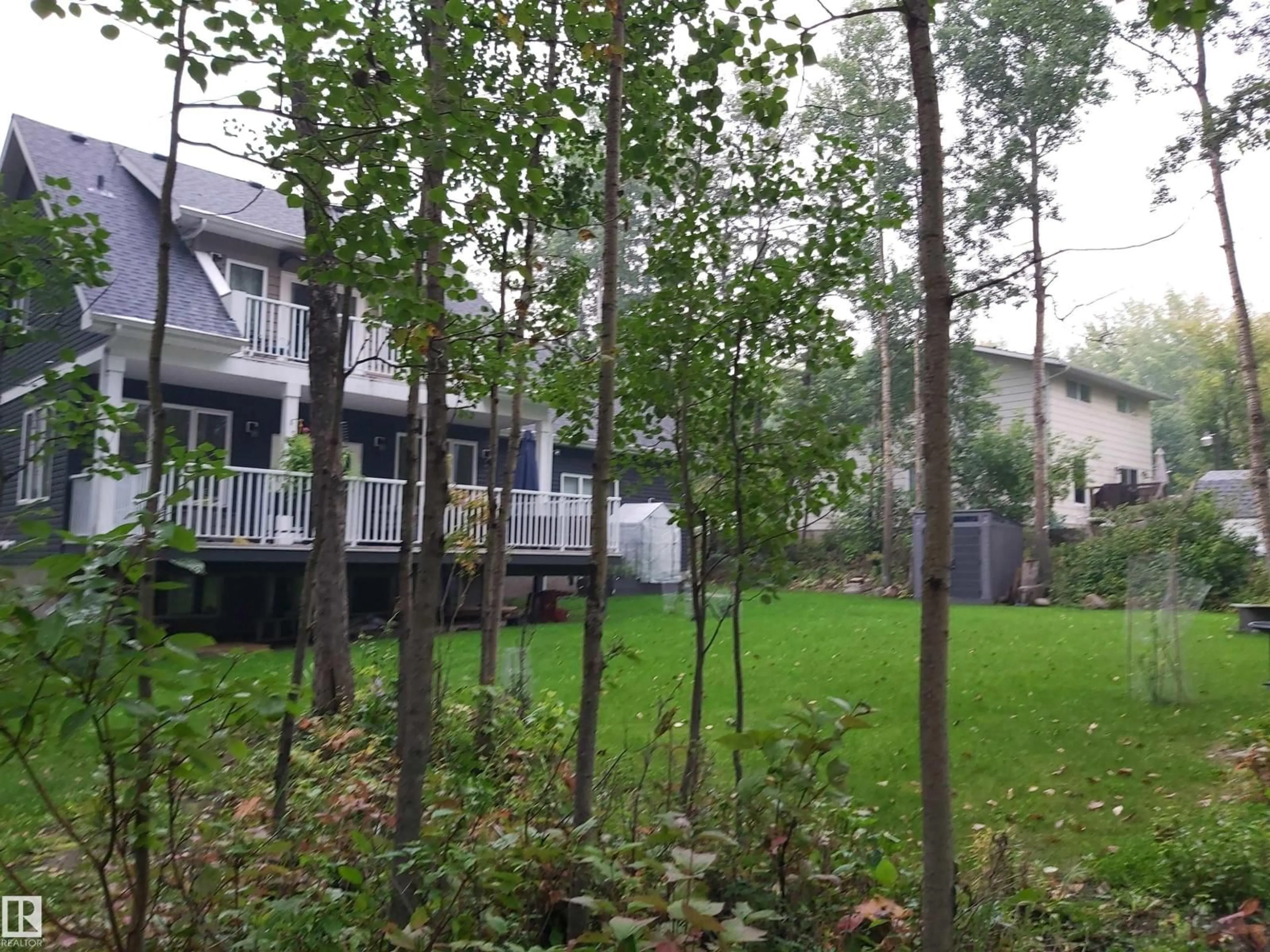 A pic from outside/outdoor area/front of a property/back of a property/a pic from drone, forest/trees view for 3 CONIFER CR, Rural Lac Ste. Anne County Alberta T0E0V0