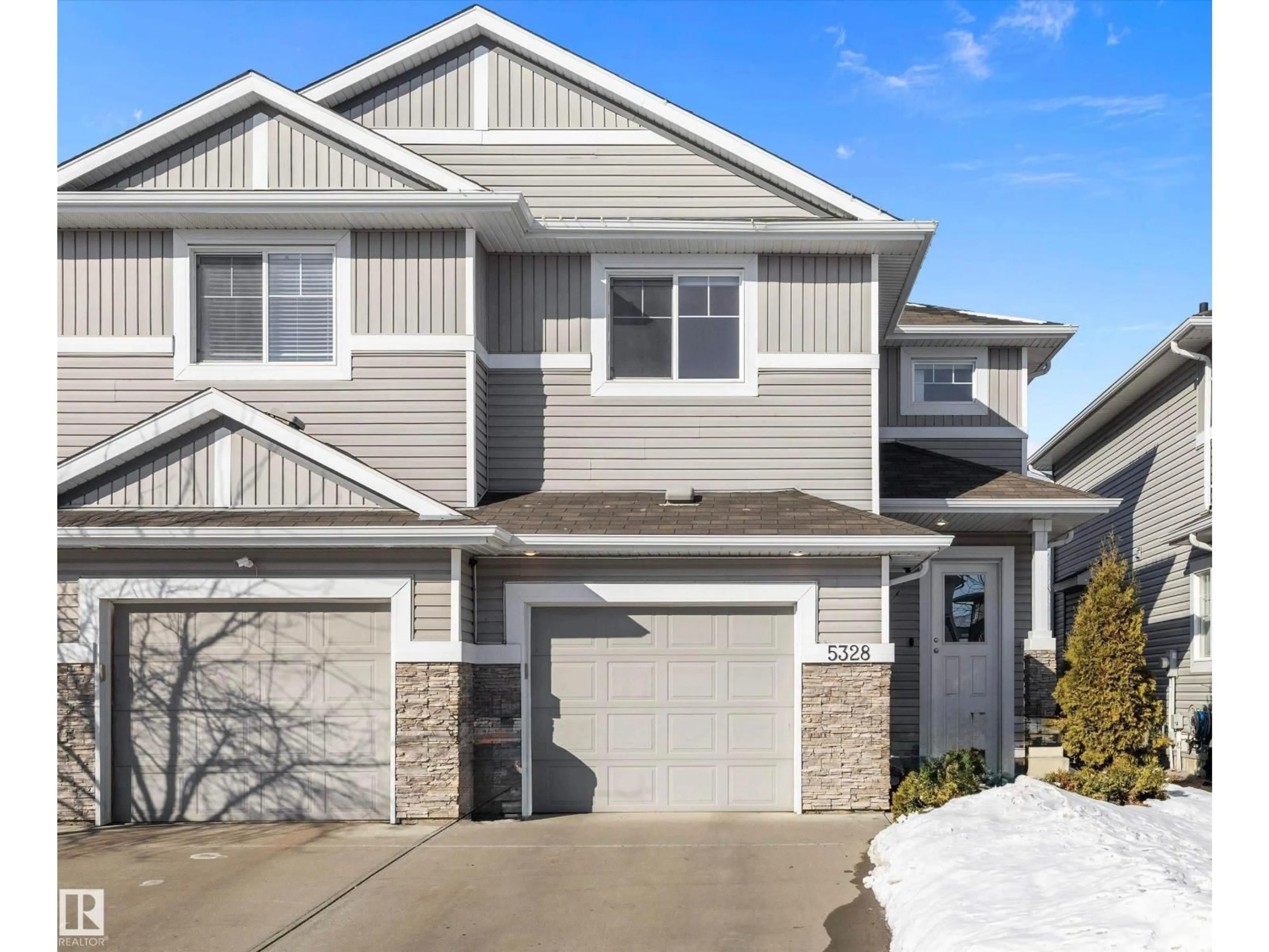 Home with vinyl exterior material, street for 5328 165 AV, Edmonton Alberta T5Y0H3