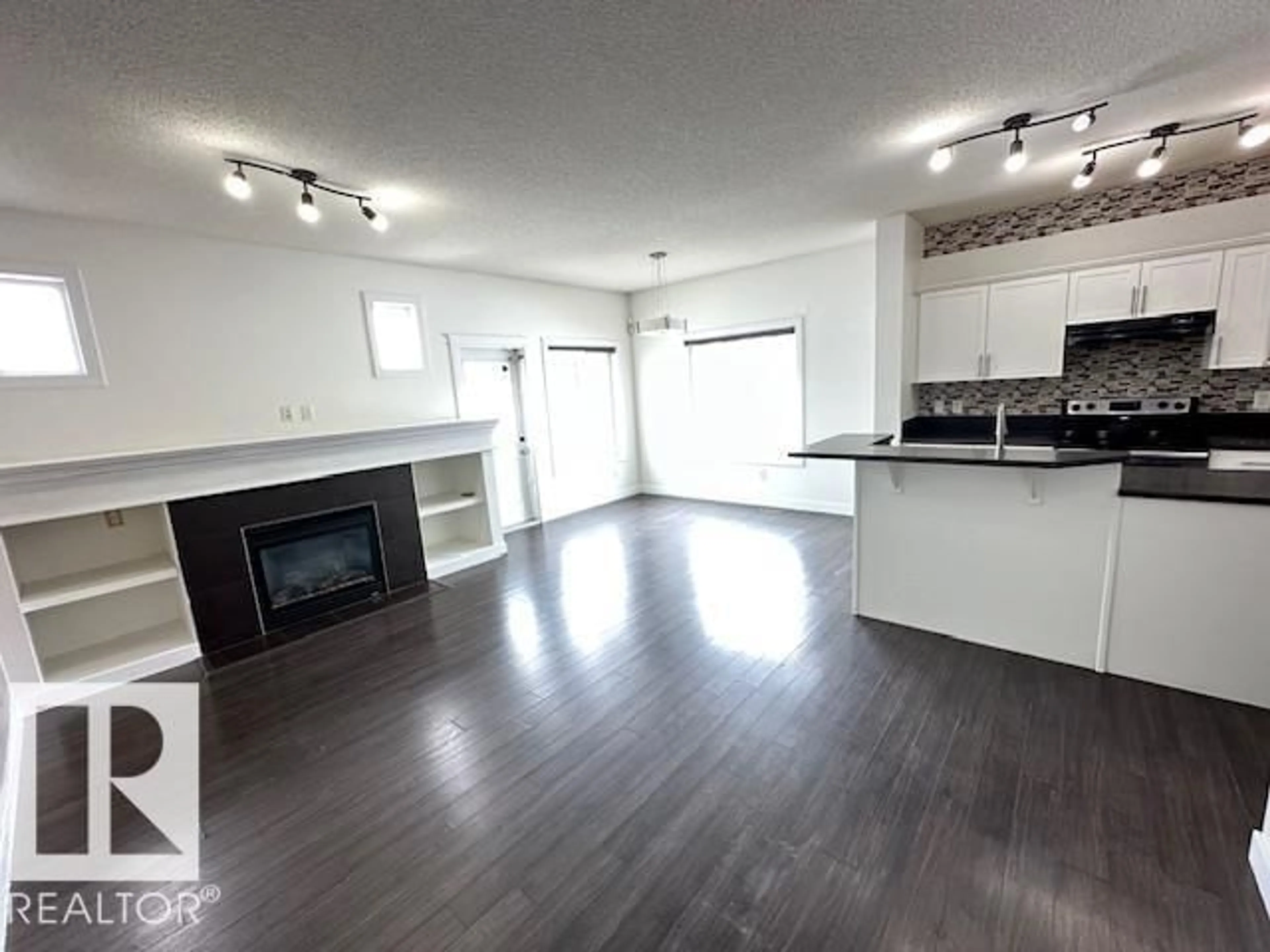 Open concept kitchen, wood/laminate floor for 112 MCLAUGHLIN DR, Spruce Grove Alberta T7X0K3