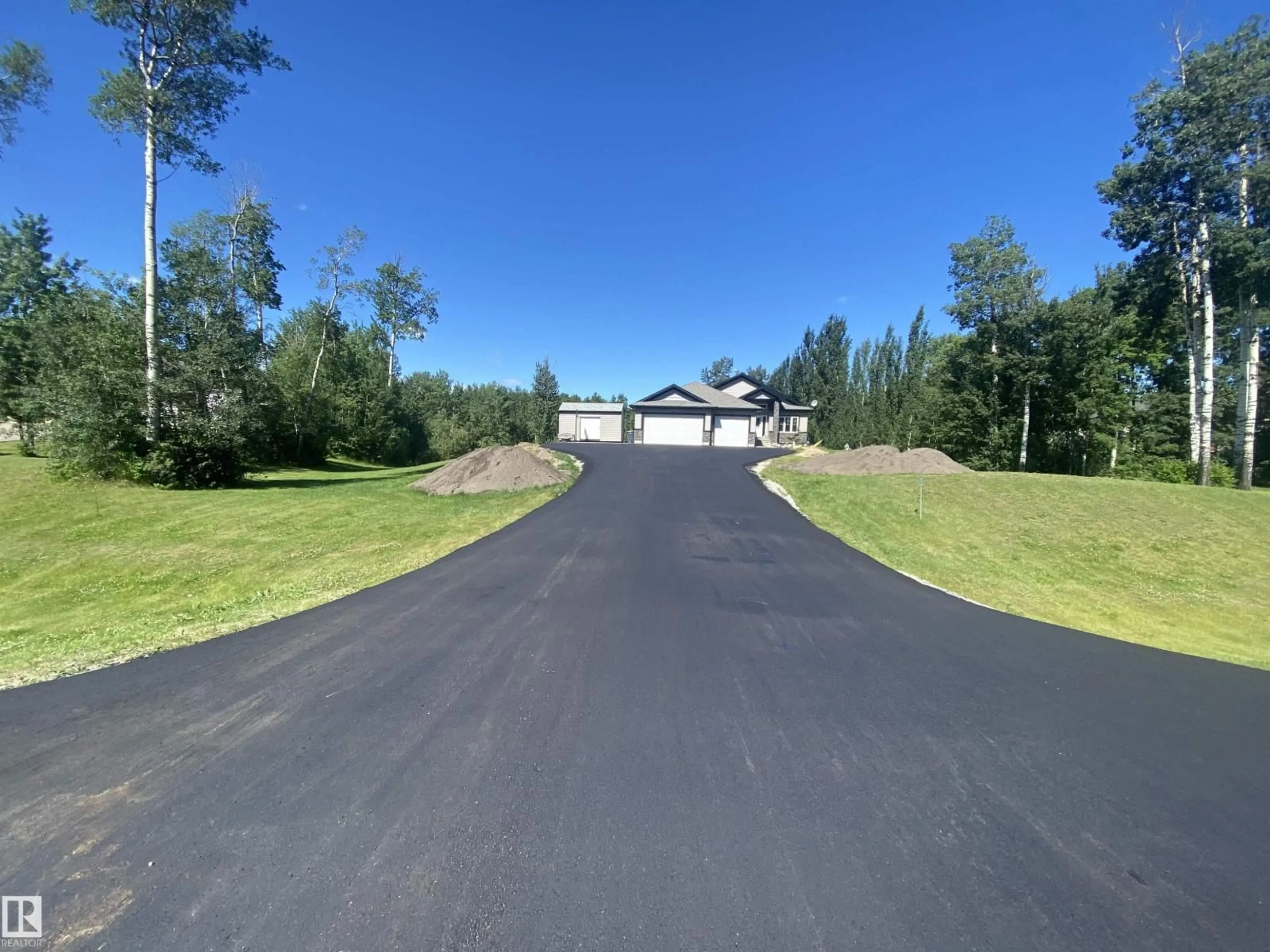 A pic from outside/outdoor area/front of a property/back of a property/a pic from drone, street for 51 - 53122 RGE ROAD 14, Rural Parkland County Alberta T7Y2T3