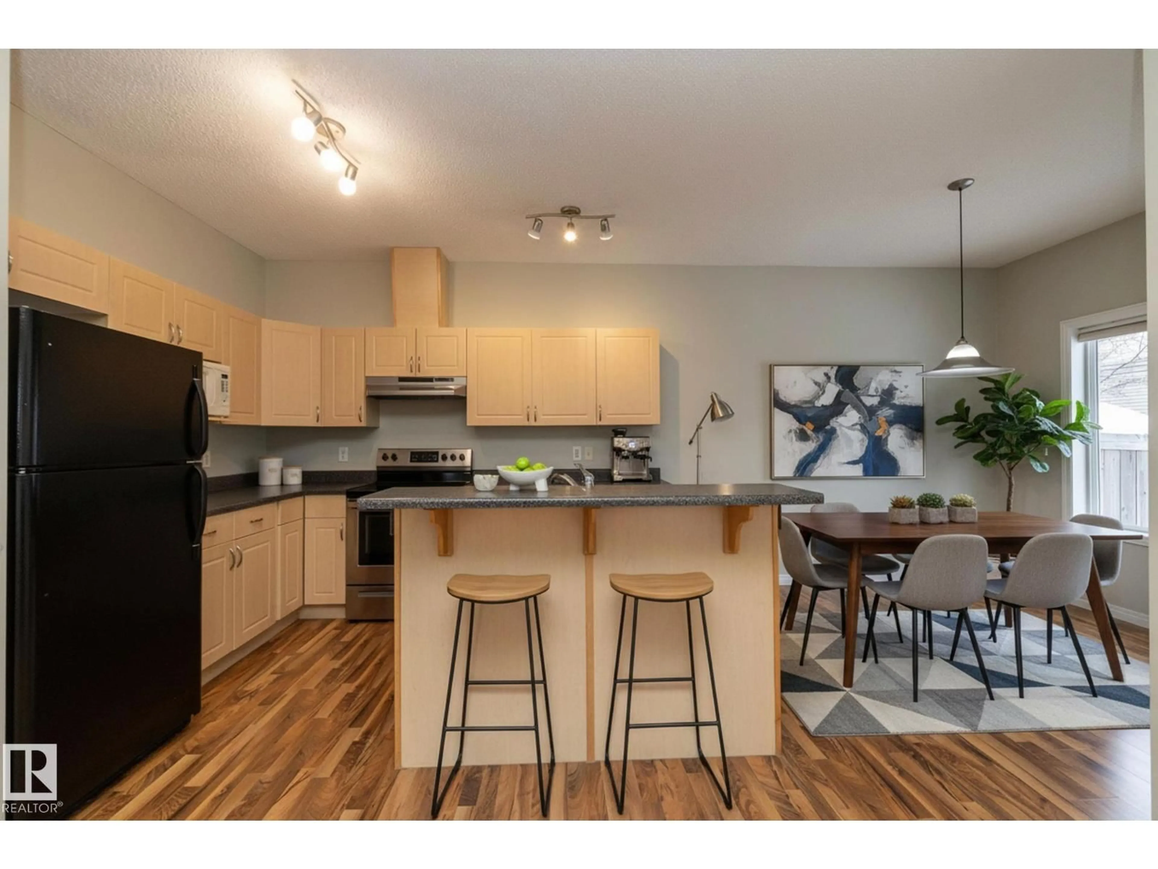 Open concept kitchen, wood/laminate floor for 1897 RUTHERFORD RD, Edmonton Alberta T6W1P6