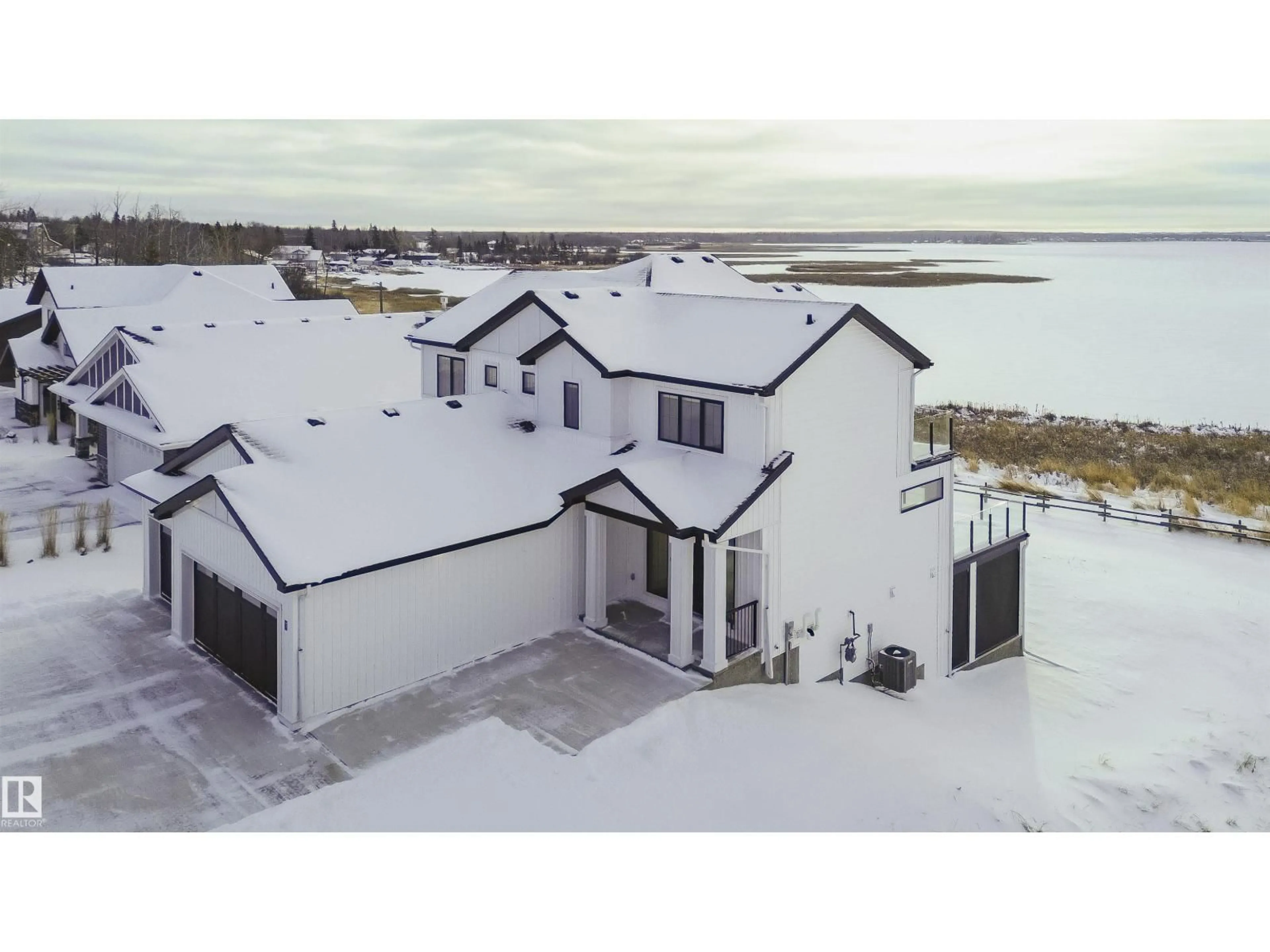 A pic from outside/outdoor area/front of a property/back of a property/a pic from drone, water/lake/river/ocean view for STE - 7 ANNE TR, Rural Lac Ste. Anne County Alberta T0E1A1