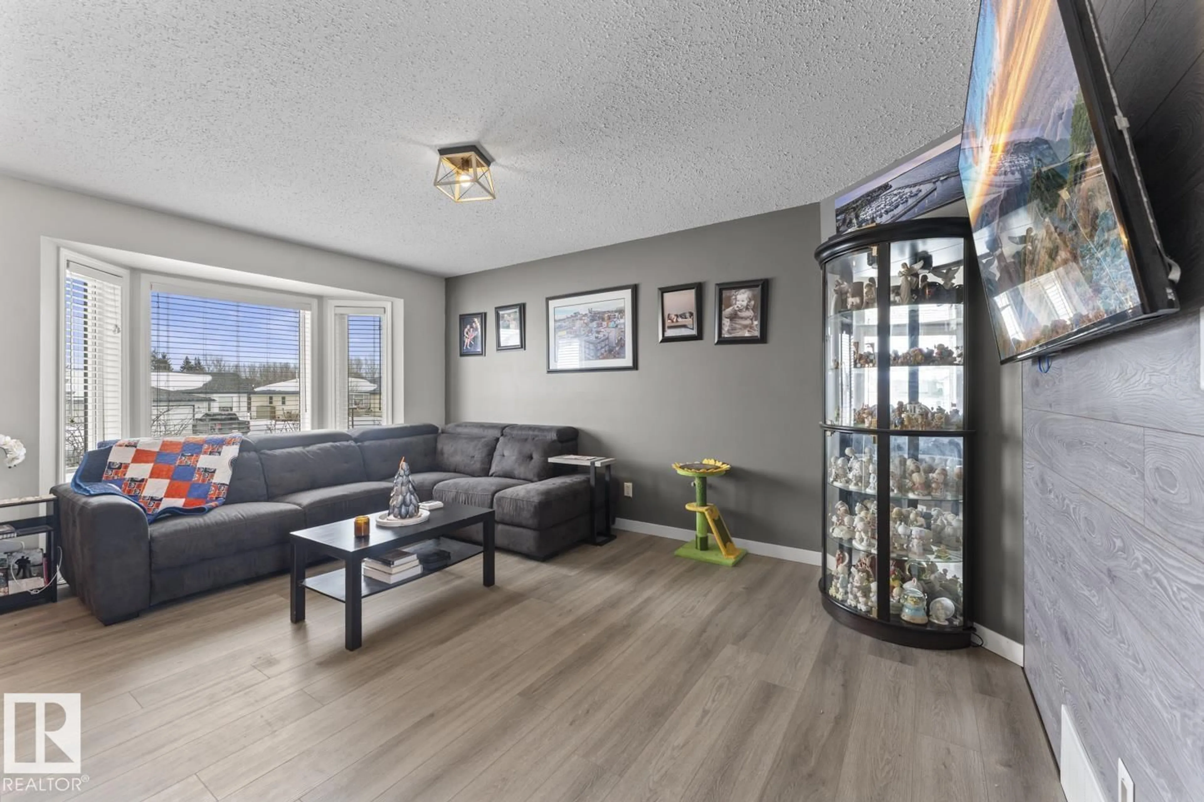 Living room with furniture, wood/laminate floor for 6111 54 AV, Cold Lake Alberta T9M2C8