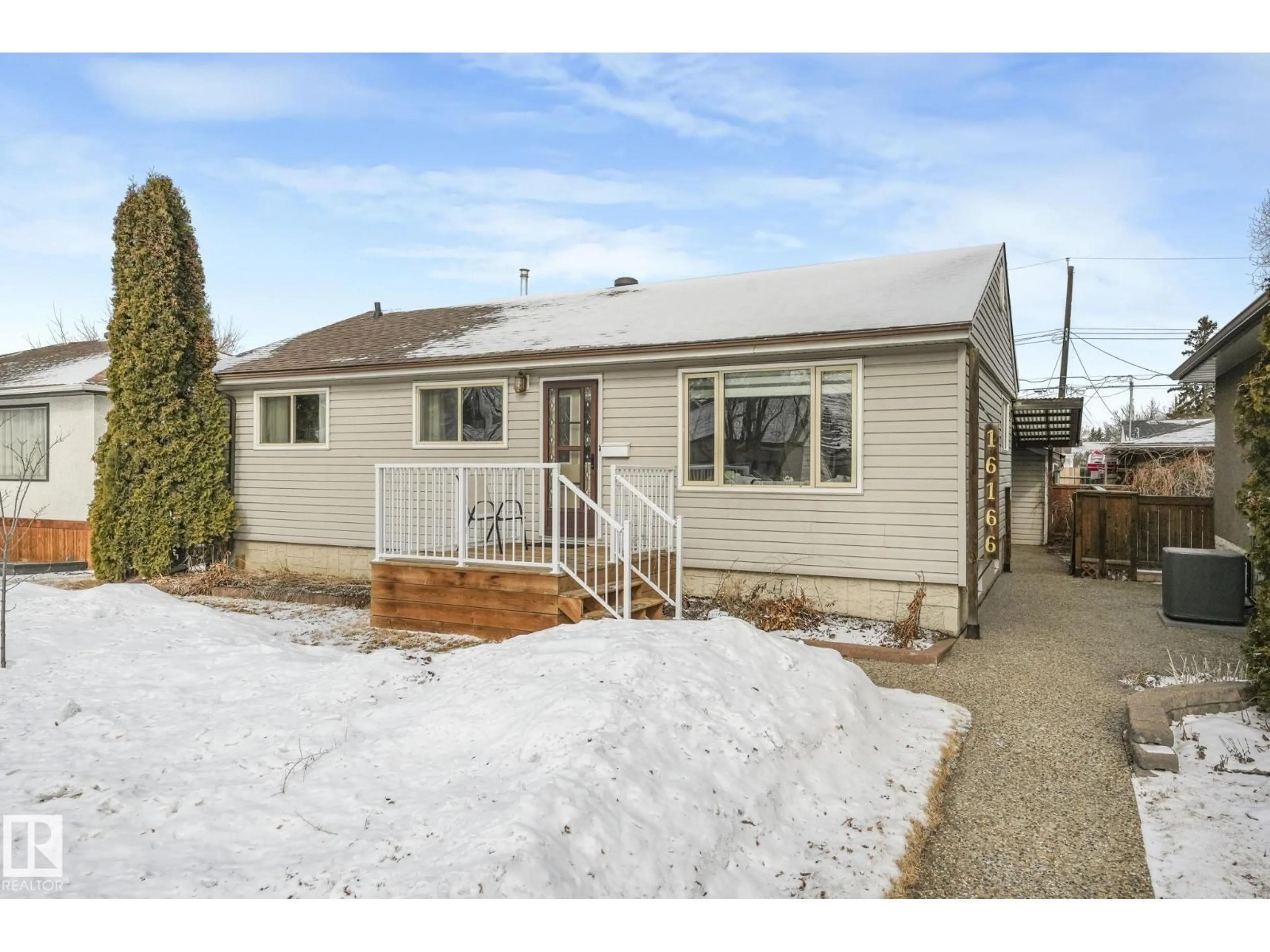 Home with vinyl exterior material, street for 16166 107A AV NW, Edmonton Alberta T5P4E1