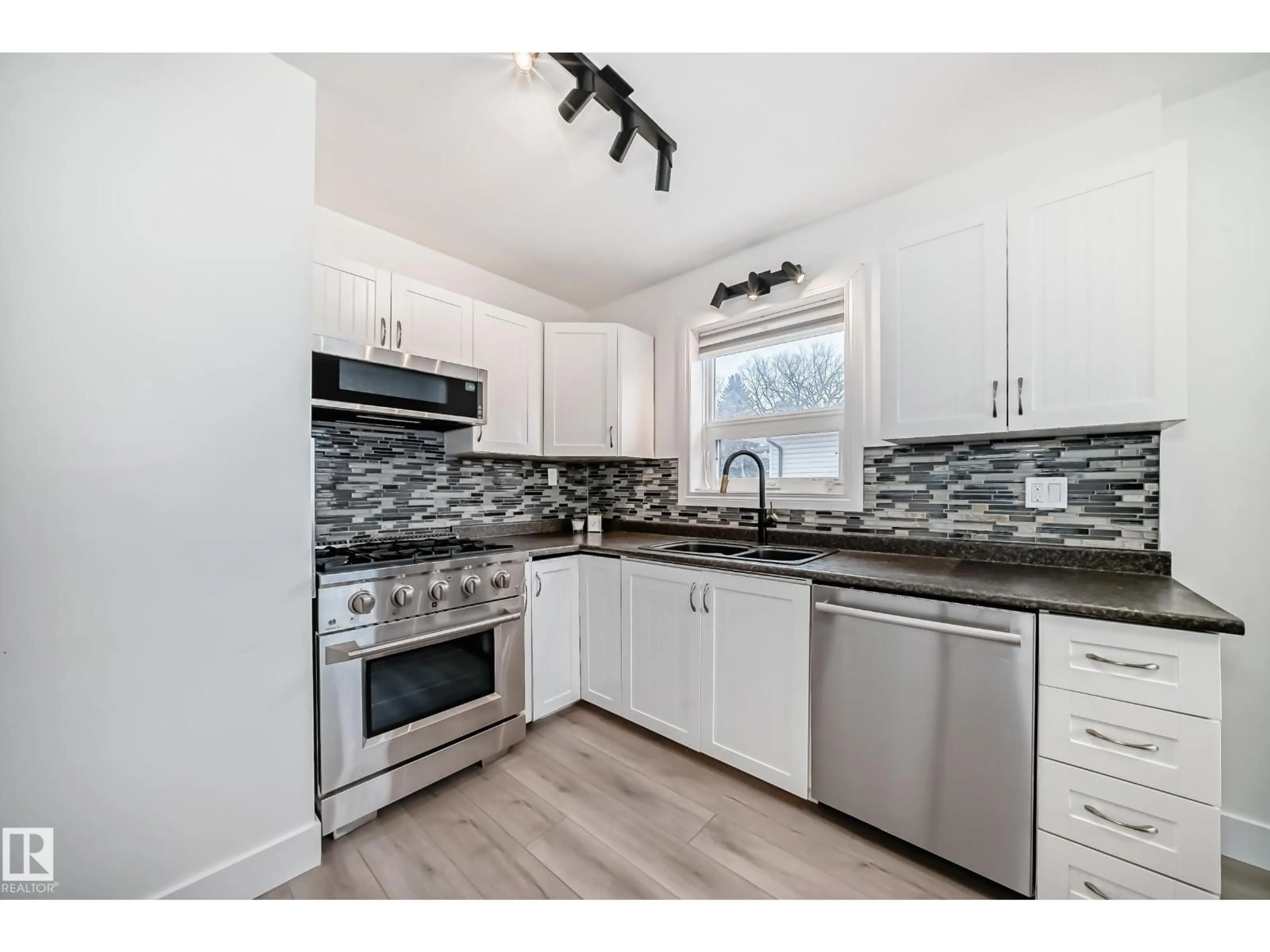 Open concept kitchen, unknown for NW - 10703 65 AV, Edmonton Alberta T6H1V5