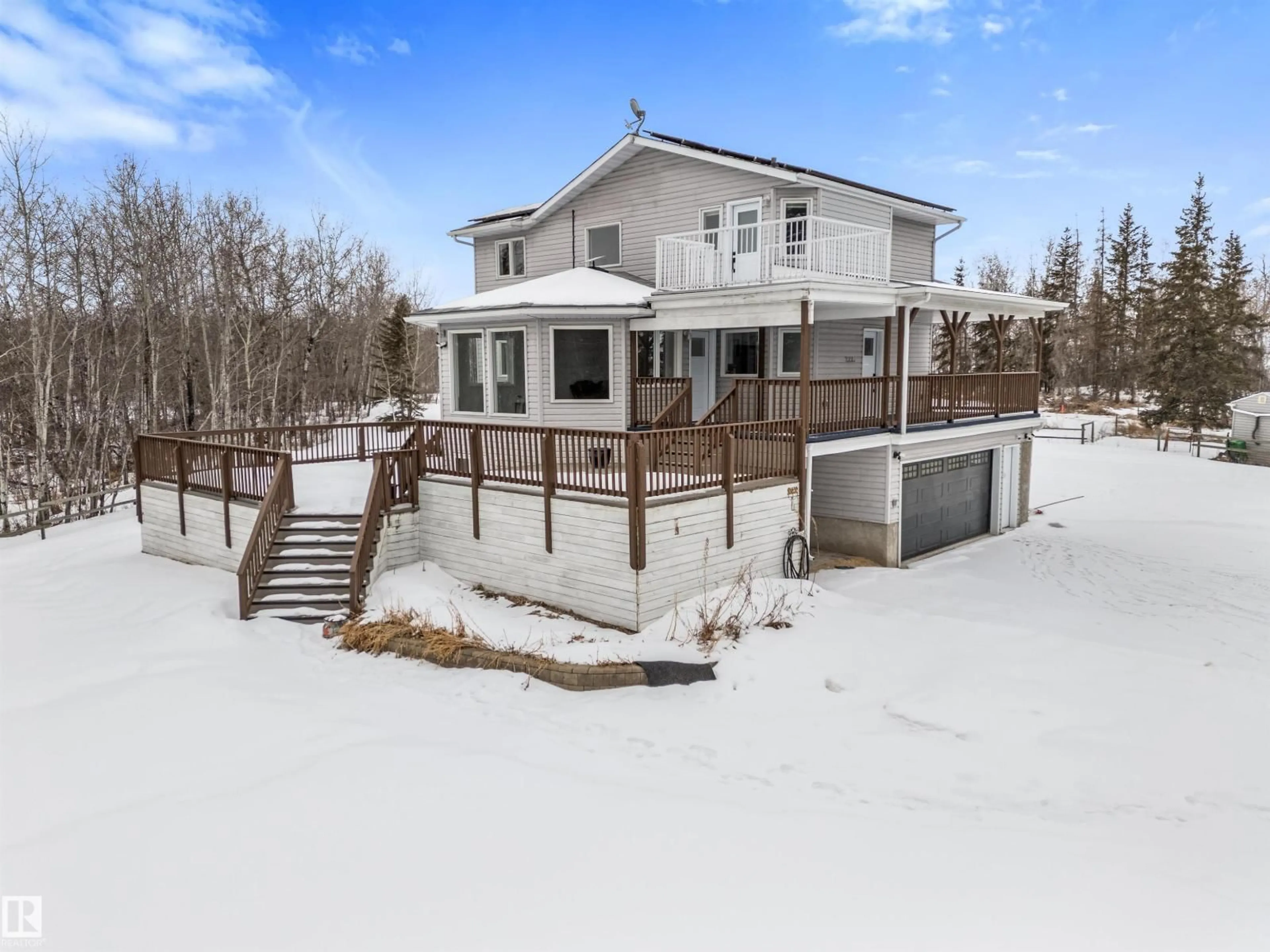 A pic from outside/outdoor area/front of a property/back of a property/a pic from drone, water/lake/river/ocean view for 50516A RR13 NW, Rural Parkland County Alberta T7Z1X1