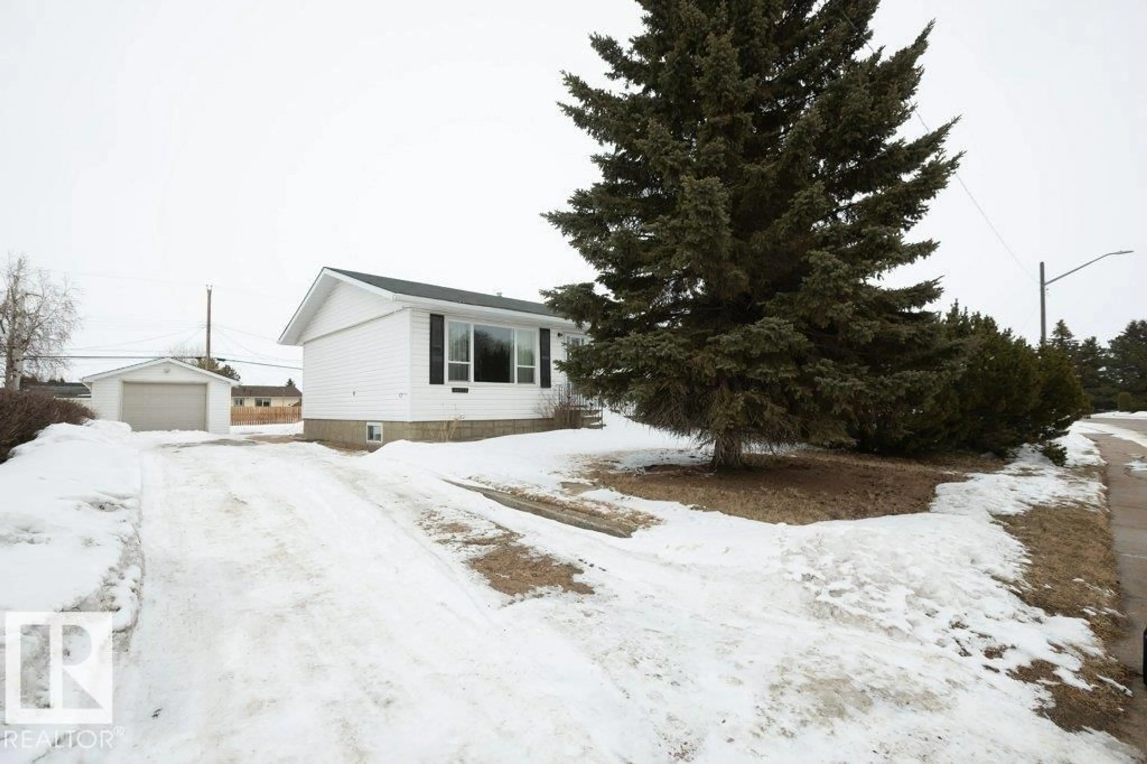 A pic from outside/outdoor area/front of a property/back of a property/a pic from drone, street for 10516 104 ST, Westlock Alberta T7P1M1