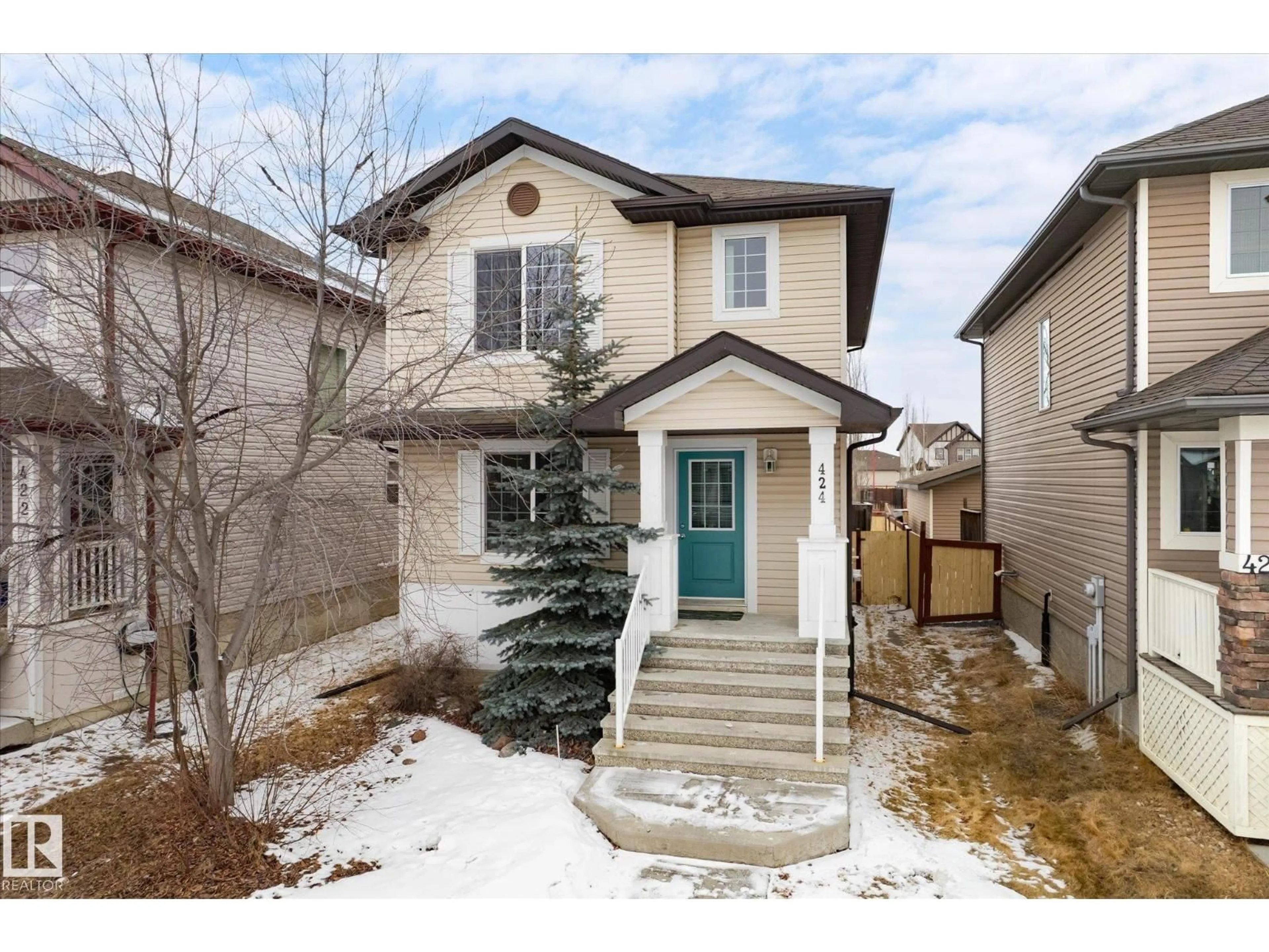 Home with vinyl exterior material, street for 424 SONGHURST ST, Leduc Alberta T9E0R7