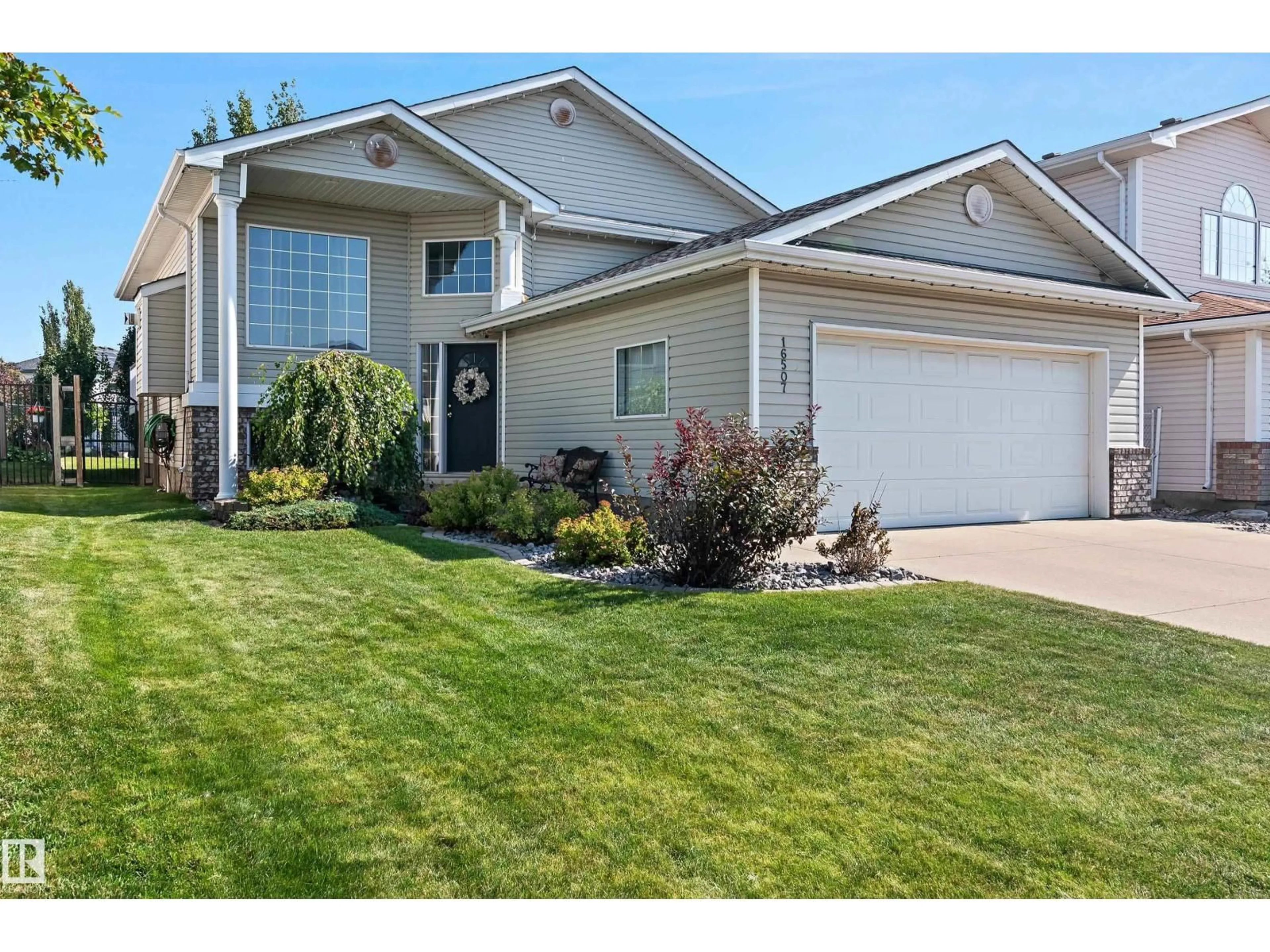 Home with vinyl exterior material, street for 16507 81 ST, Edmonton Alberta T5Z3J4