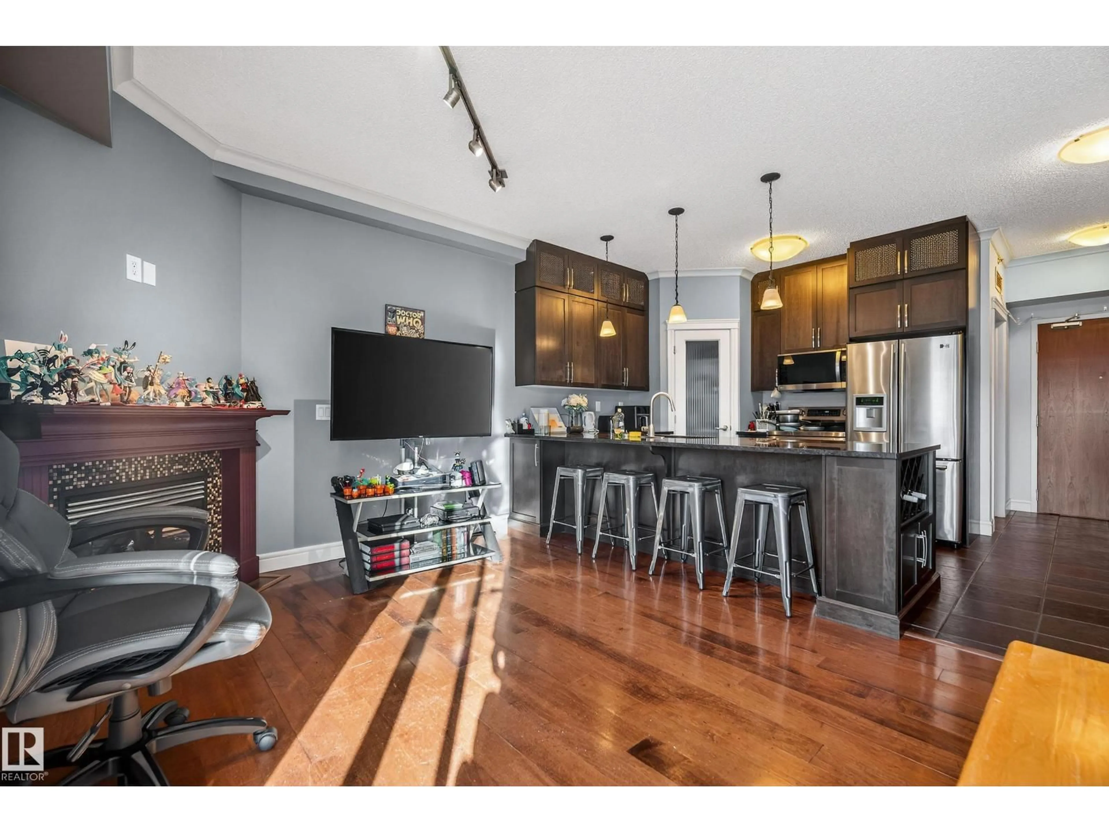 Open concept kitchen, wood/laminate floor for #307 - 9750 94 ST, Edmonton Alberta T6C2E3